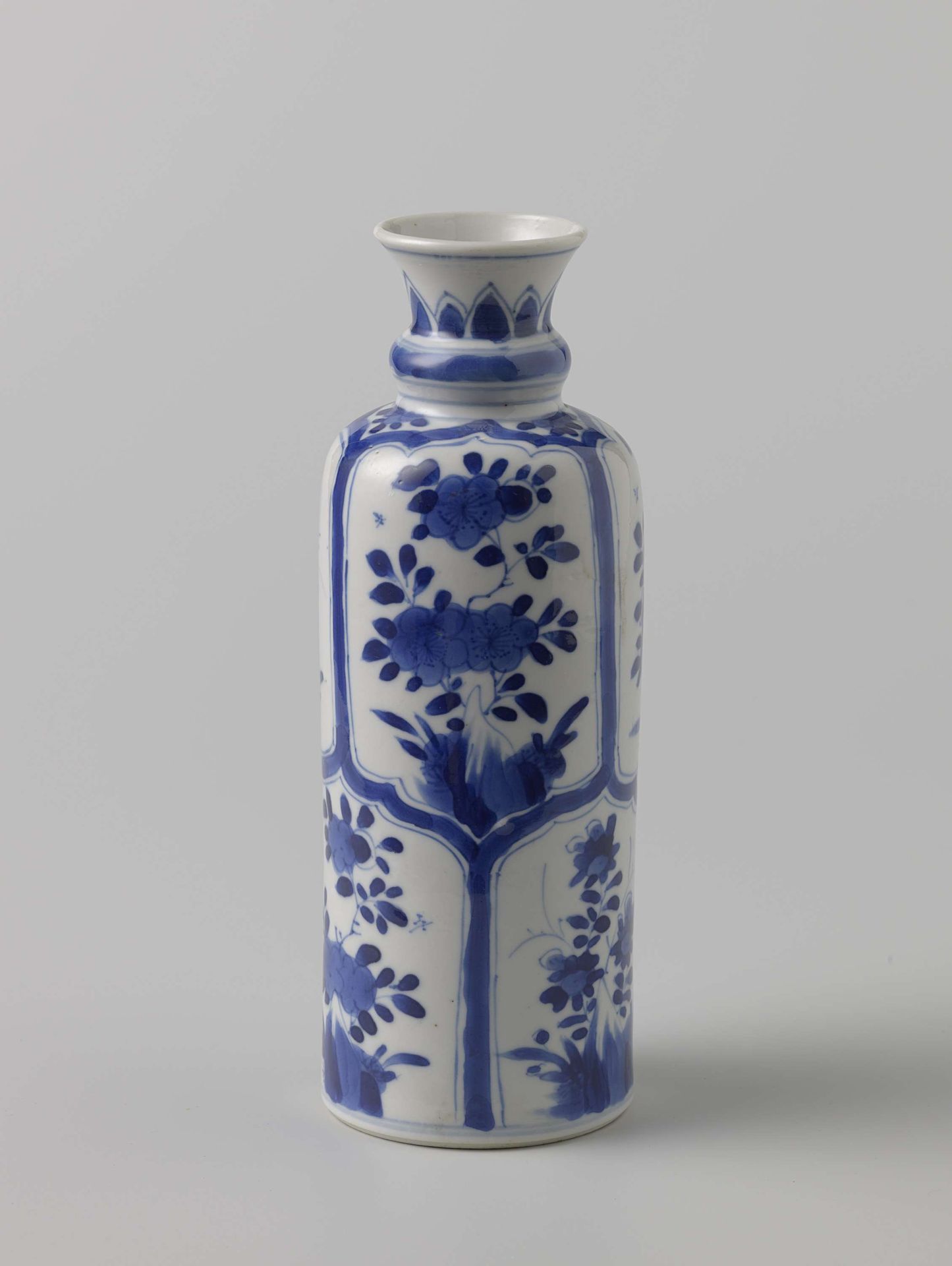 Cylindrical bottle vase with panel decoration with flower sprays by Anonymous