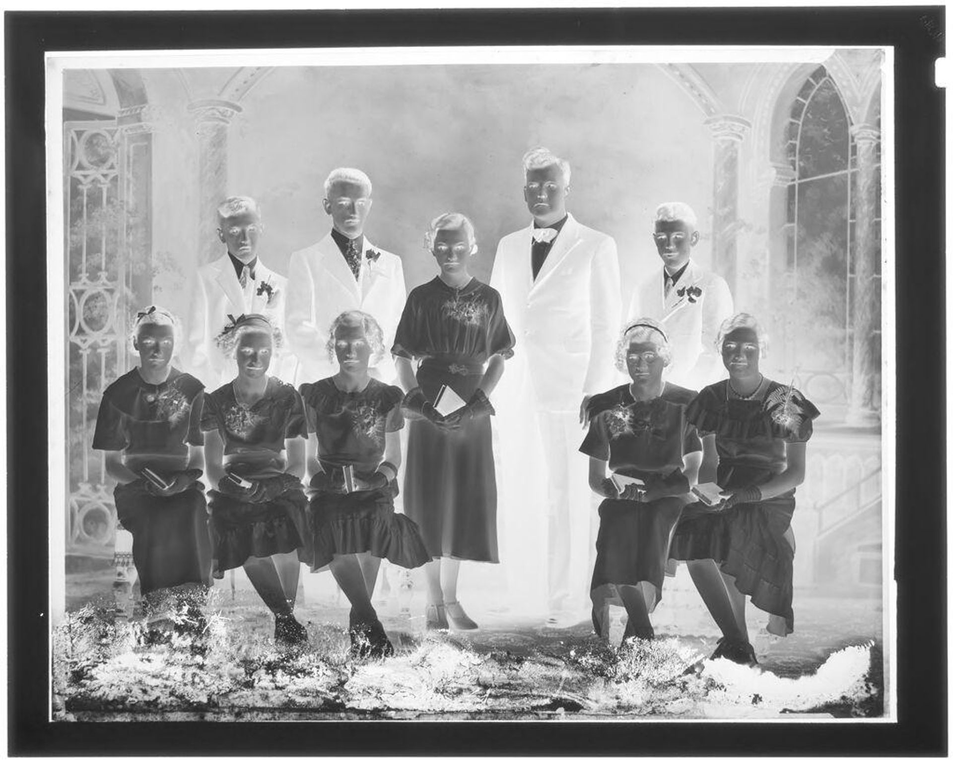Untitled (four men and six women in formal wear, studio group portrait) by John Deusing