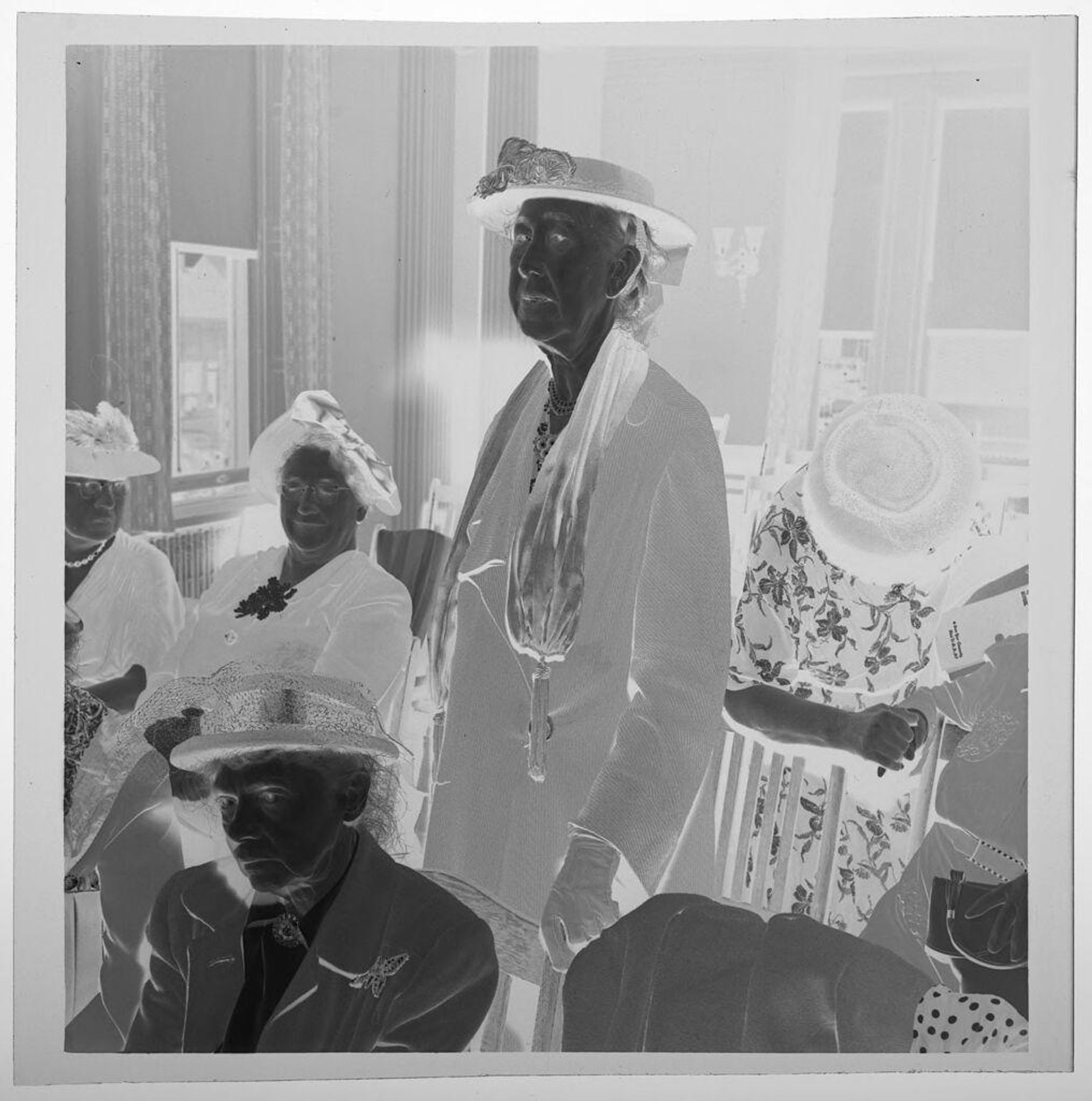 Untitled (standing and seated woman at DAR meeting) by Jack Gould