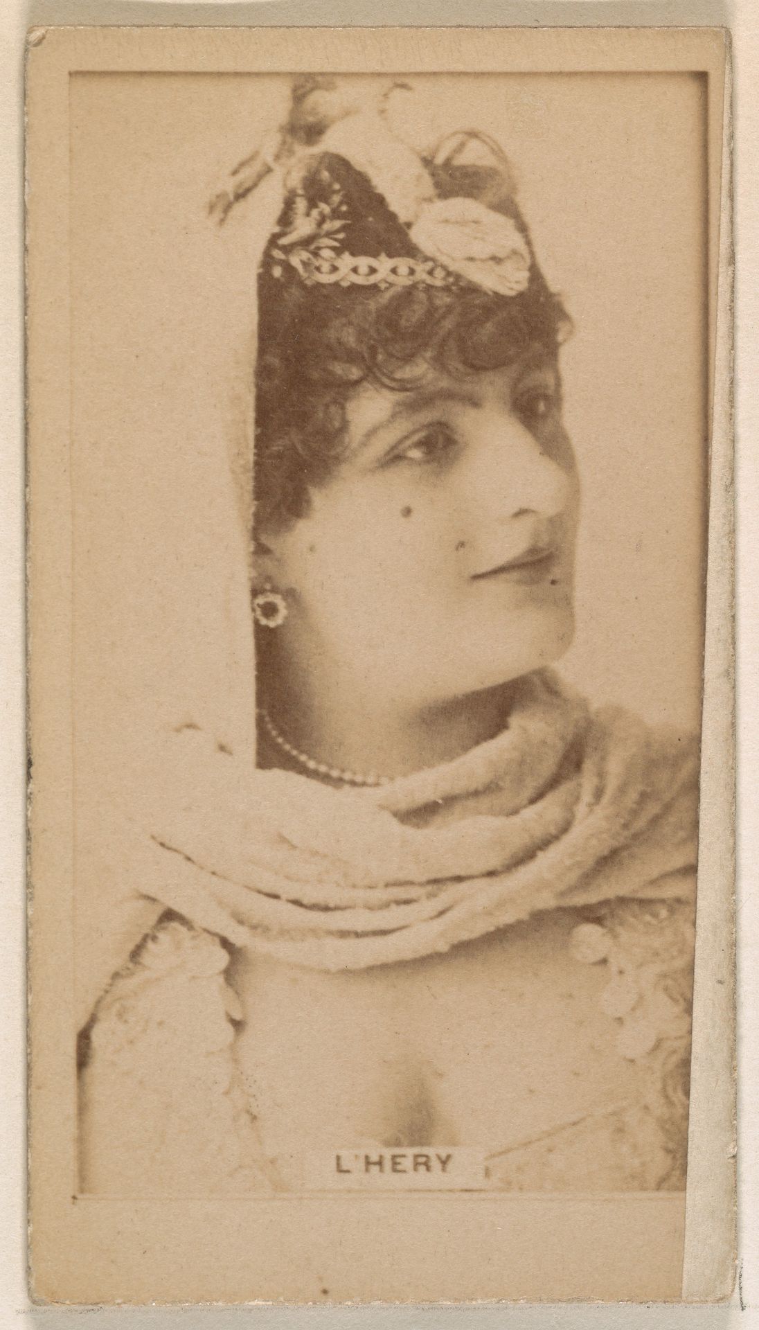 Miss L'Hery, from the Actresses series (N245) issued by Kinney Brothers to promote Sweet Caporal Cigarettes by Kinney Brothers Tobacco Company