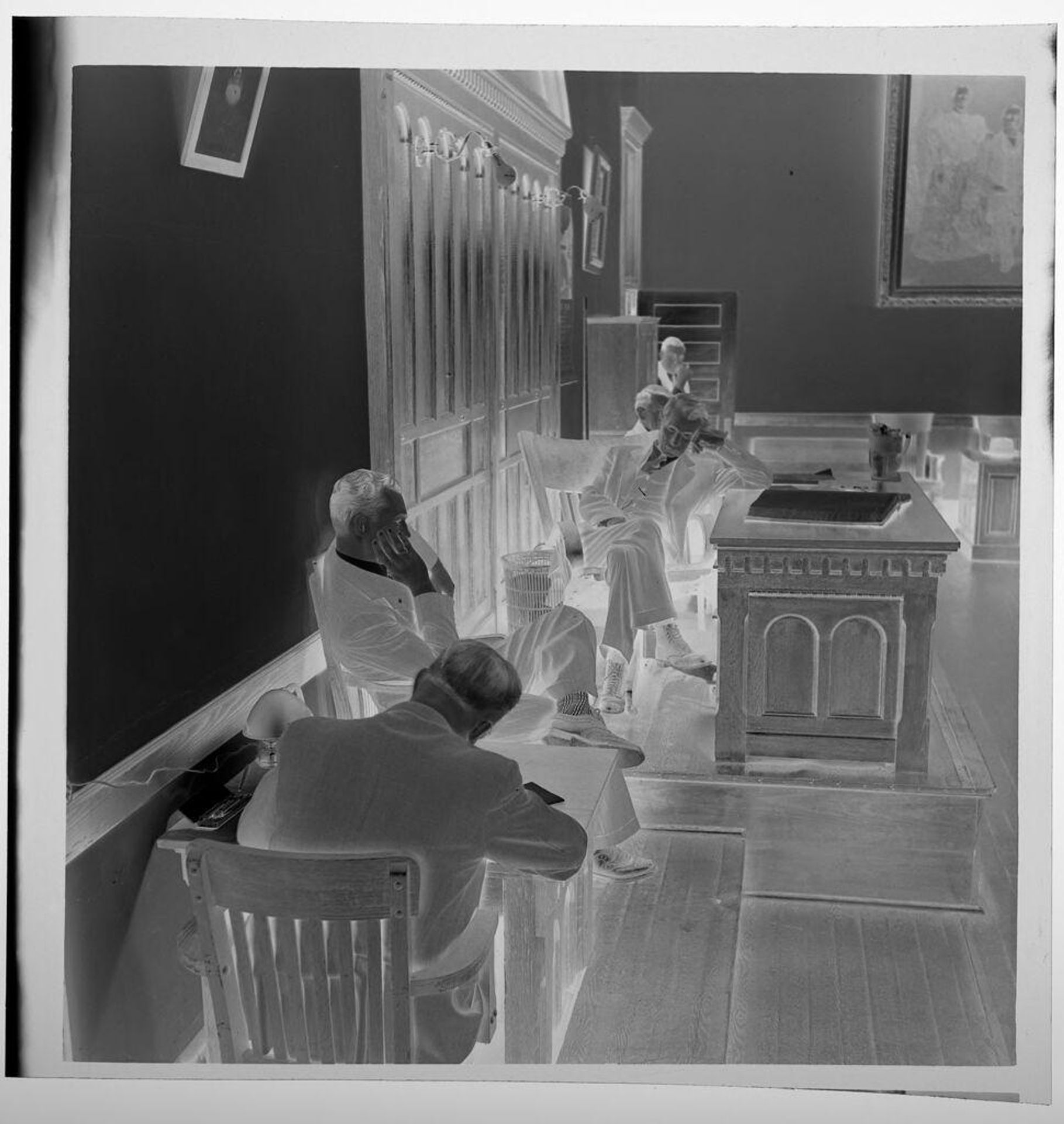 Untitled (judge at his desk talking with other men) by Jack Gould