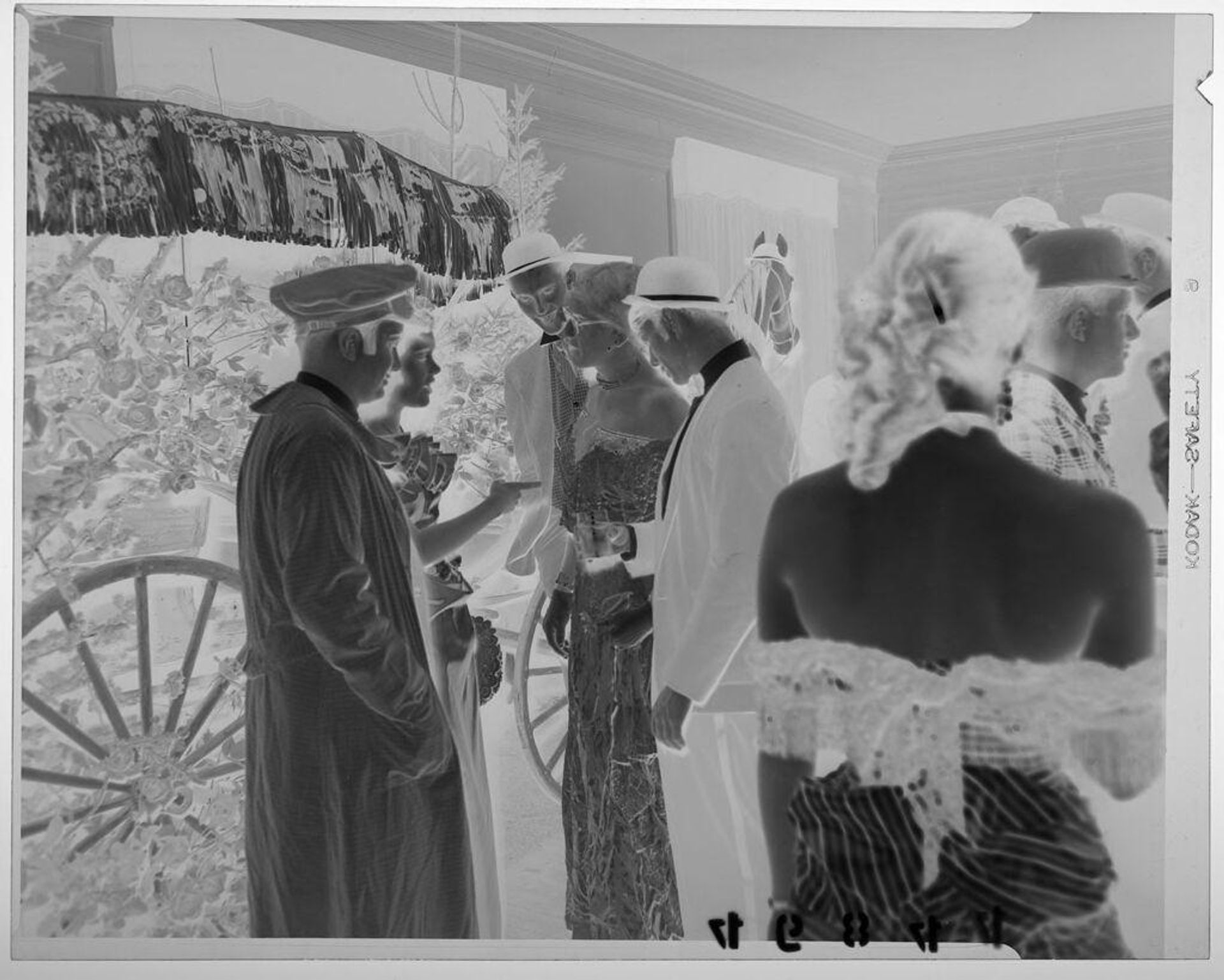 Untitled (five young men and women talking at New Year's party) by Martin Schweig