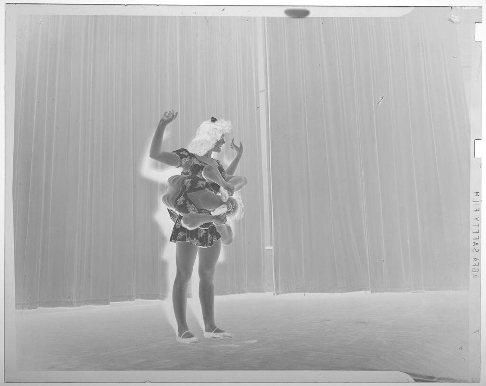 Untitled (two women performing on stage; one woman's body is wrapped around the other) by Jack Gould