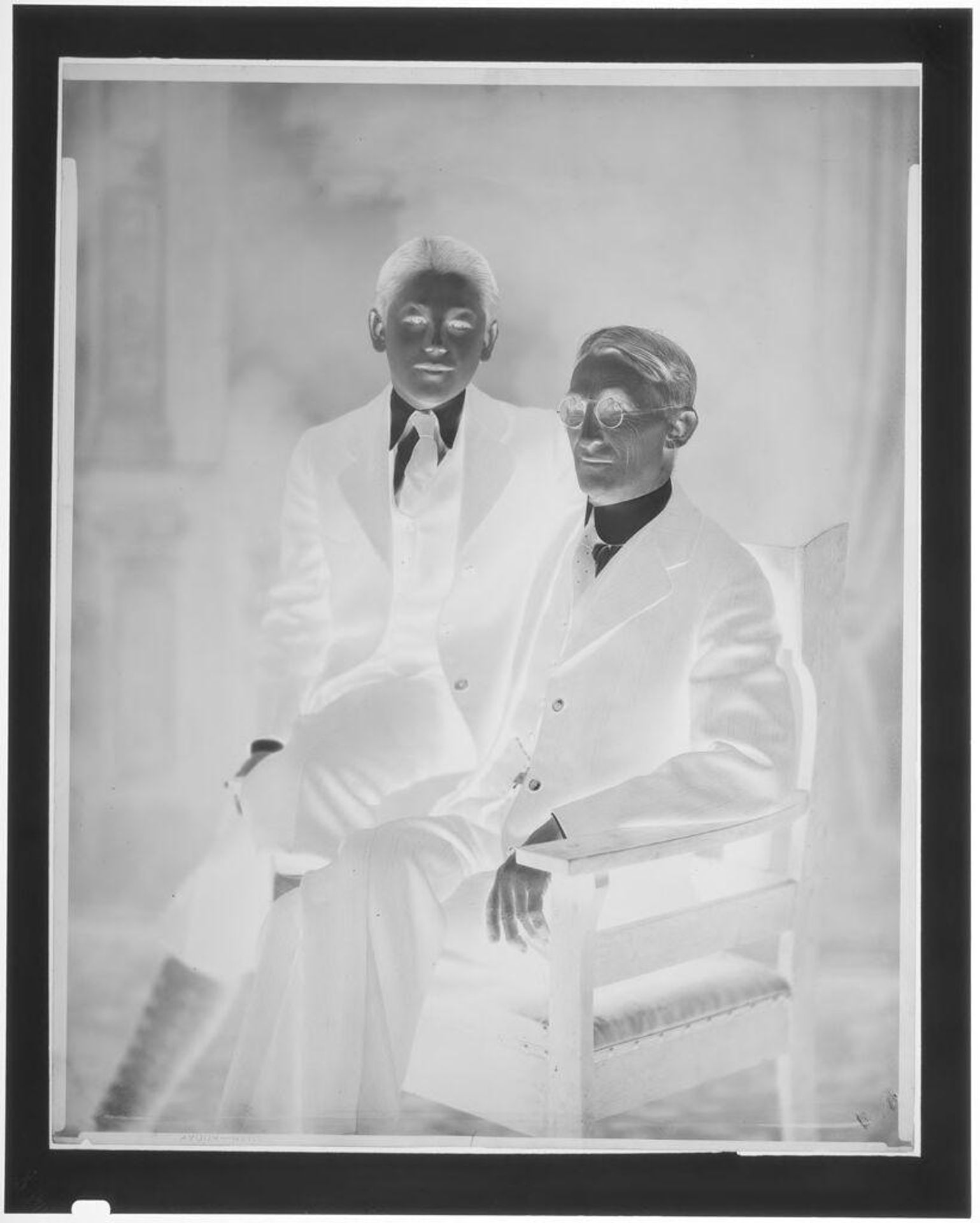 Untitled (portrait of an older and younger man) by Hamblin Studio
