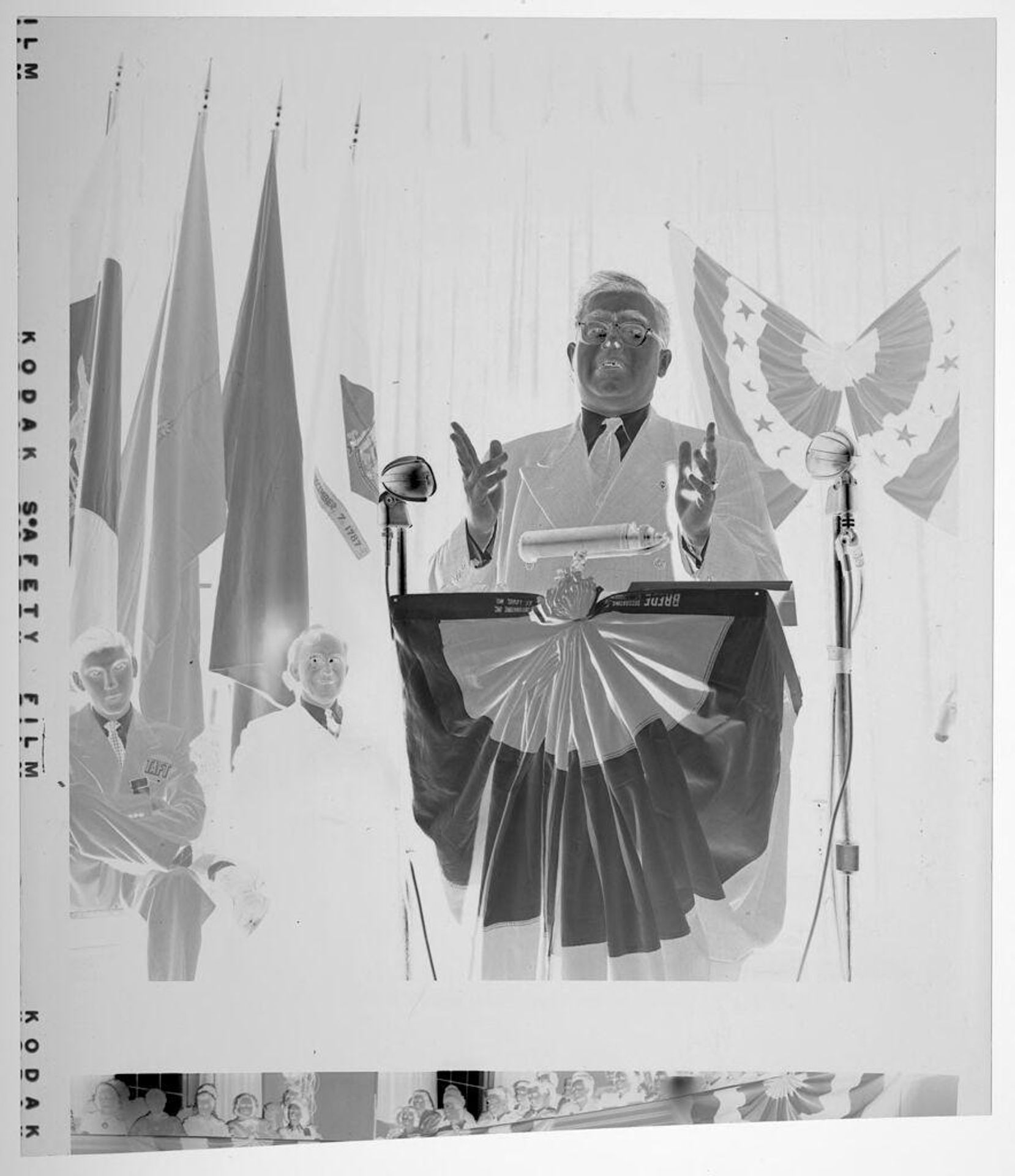 Untitled (man giving speech standing at podium at mock political convention) by Jack Gould