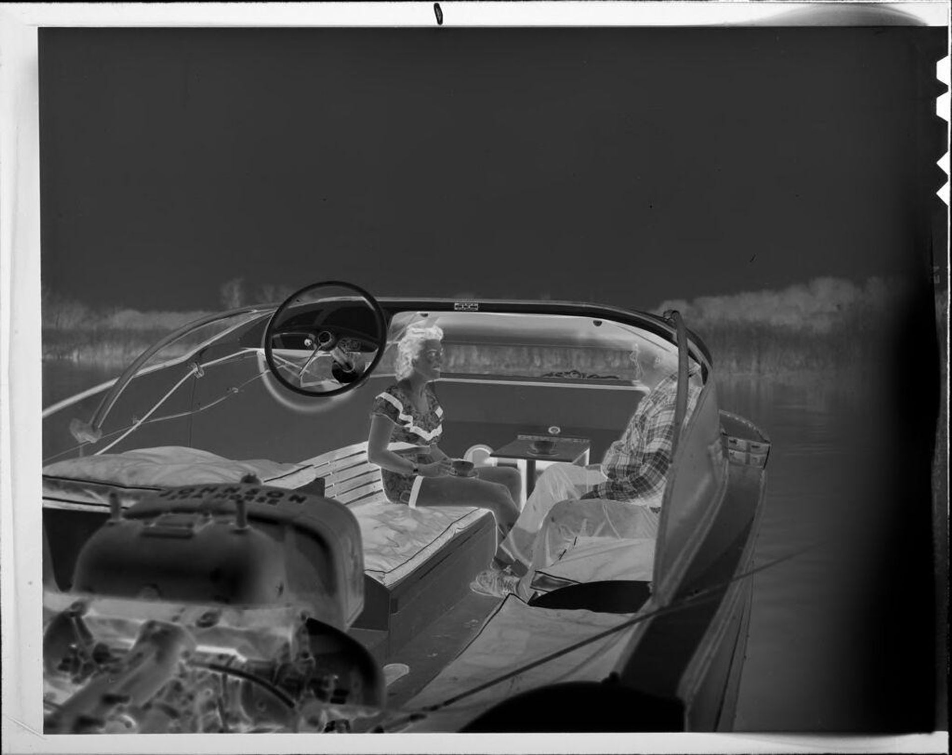 Untitled (man and woman on boat) by Lucian and Mary Brown