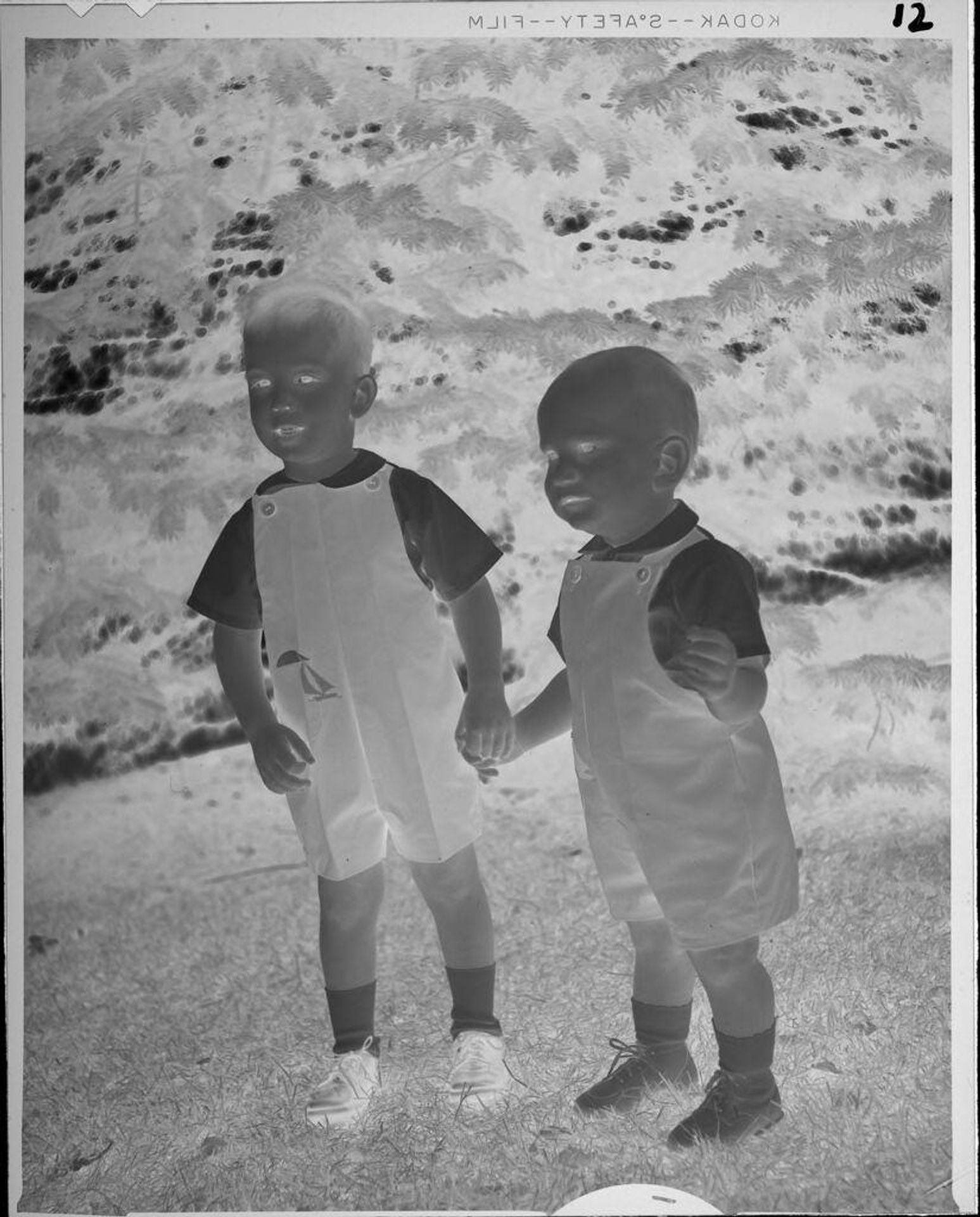 Untitled (two children in overalls standing outside) by Lucian and Mary Brown