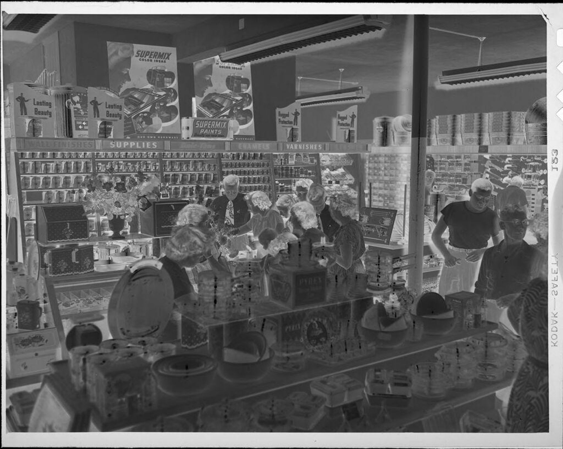 Untitled (curtomers inside hardware store) by Lucian and Mary Brown