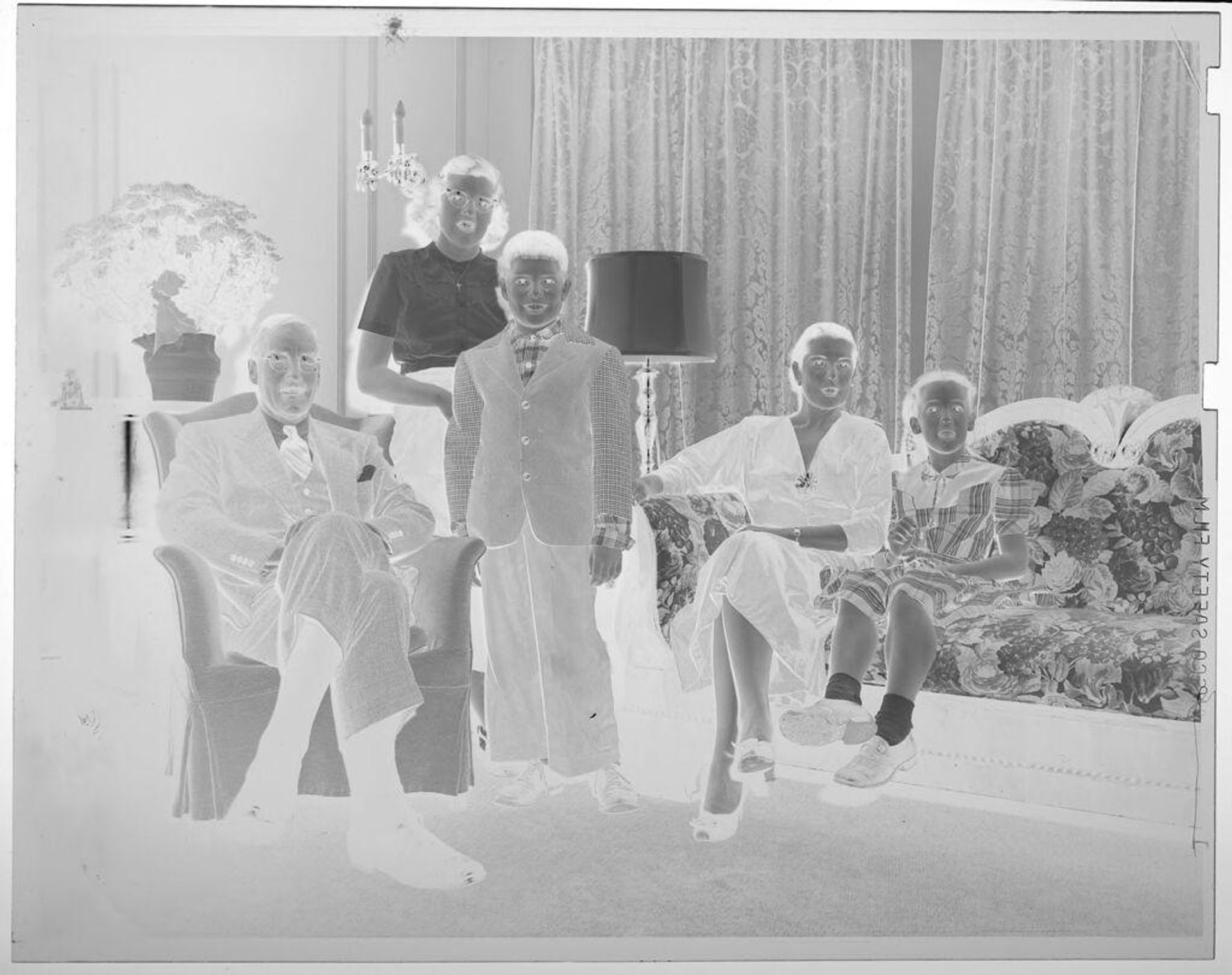 Untitled (portrait of family in living room) by Lucian and Mary Brown