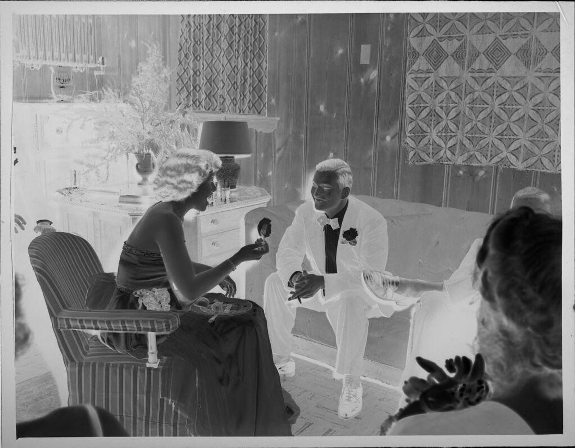 Untitled (people in living room at party ) by Lucian and Mary Brown
