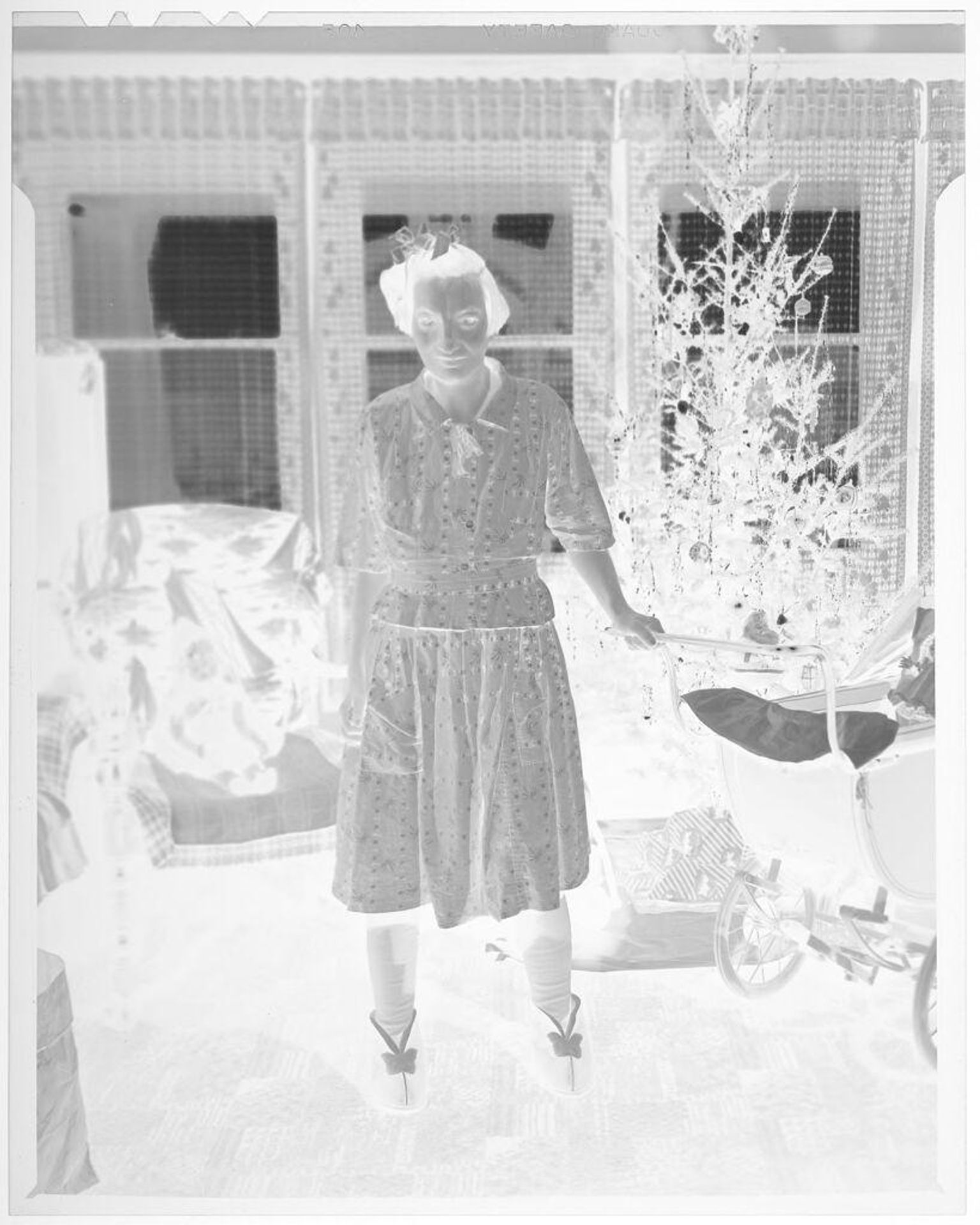 Untitled (woman with doll and baby carriage) by John Deusing