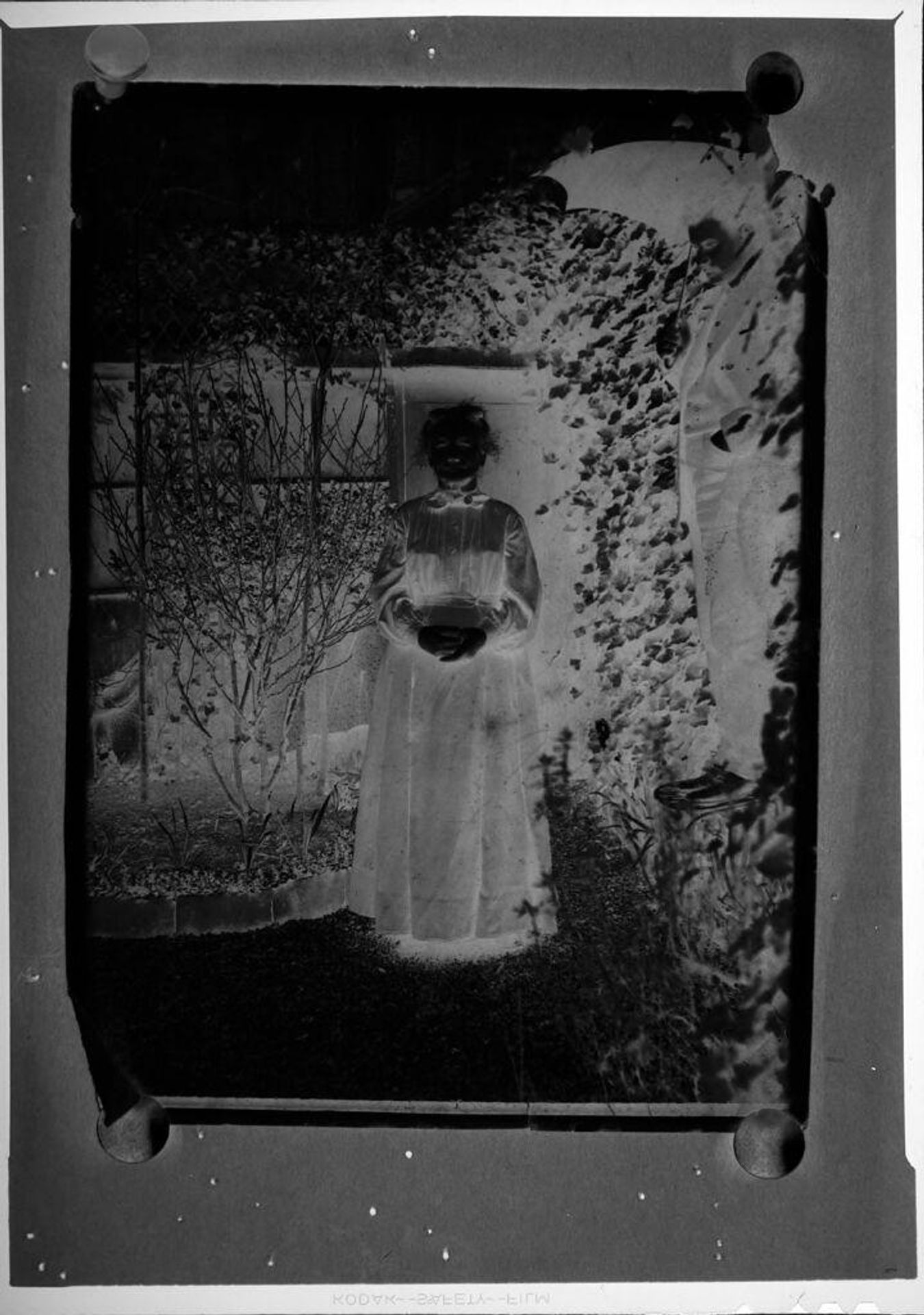 Untitled (picture of woman and man in front of house) by C. Bennette Moore