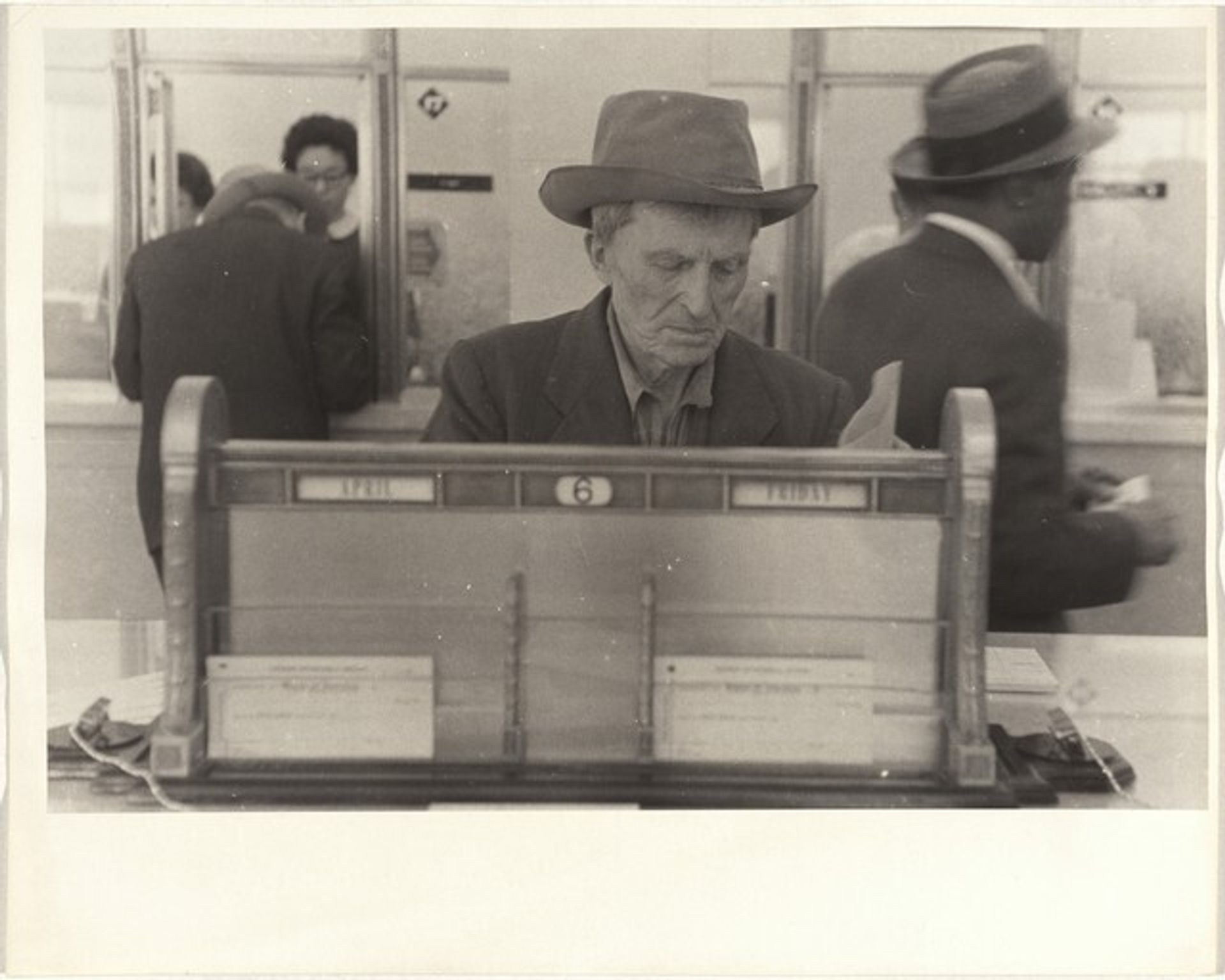 Man in bank--San Francisco by Robert Frank