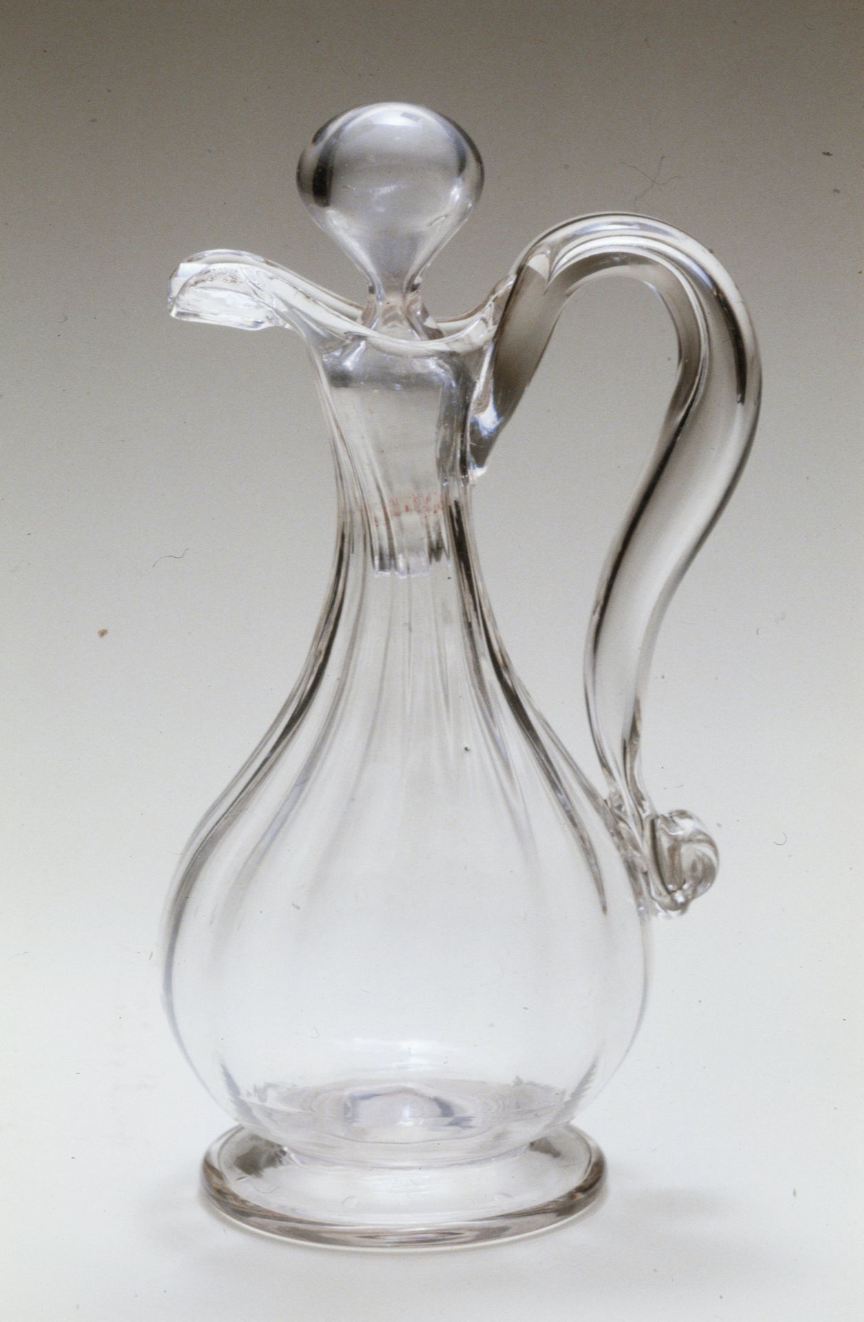 Stoppered cruet with scroll handle by Anonymous