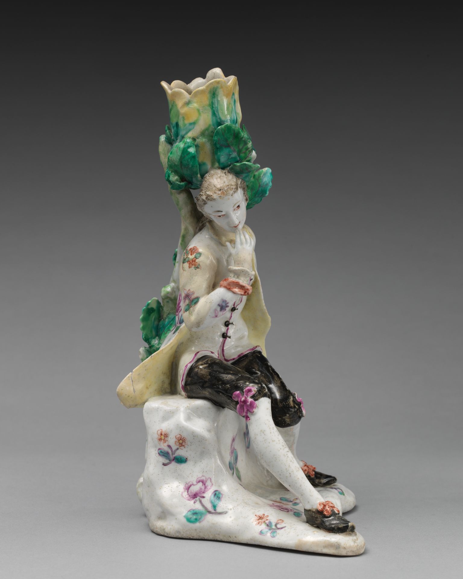 Candlestick in the form of a male dozing figure (one of a pair) by Saint James's Factory