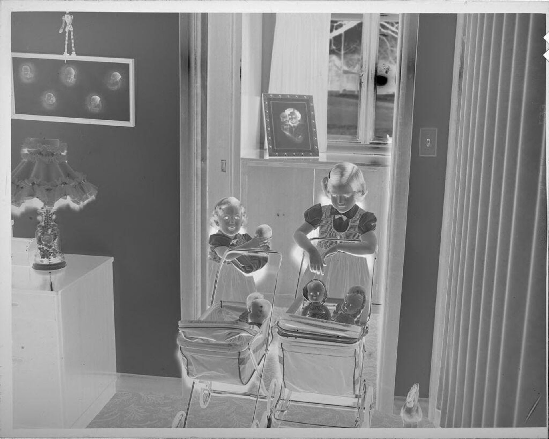 Untitled (two girls with dolls in baby carriages) by Lucian and Mary Brown