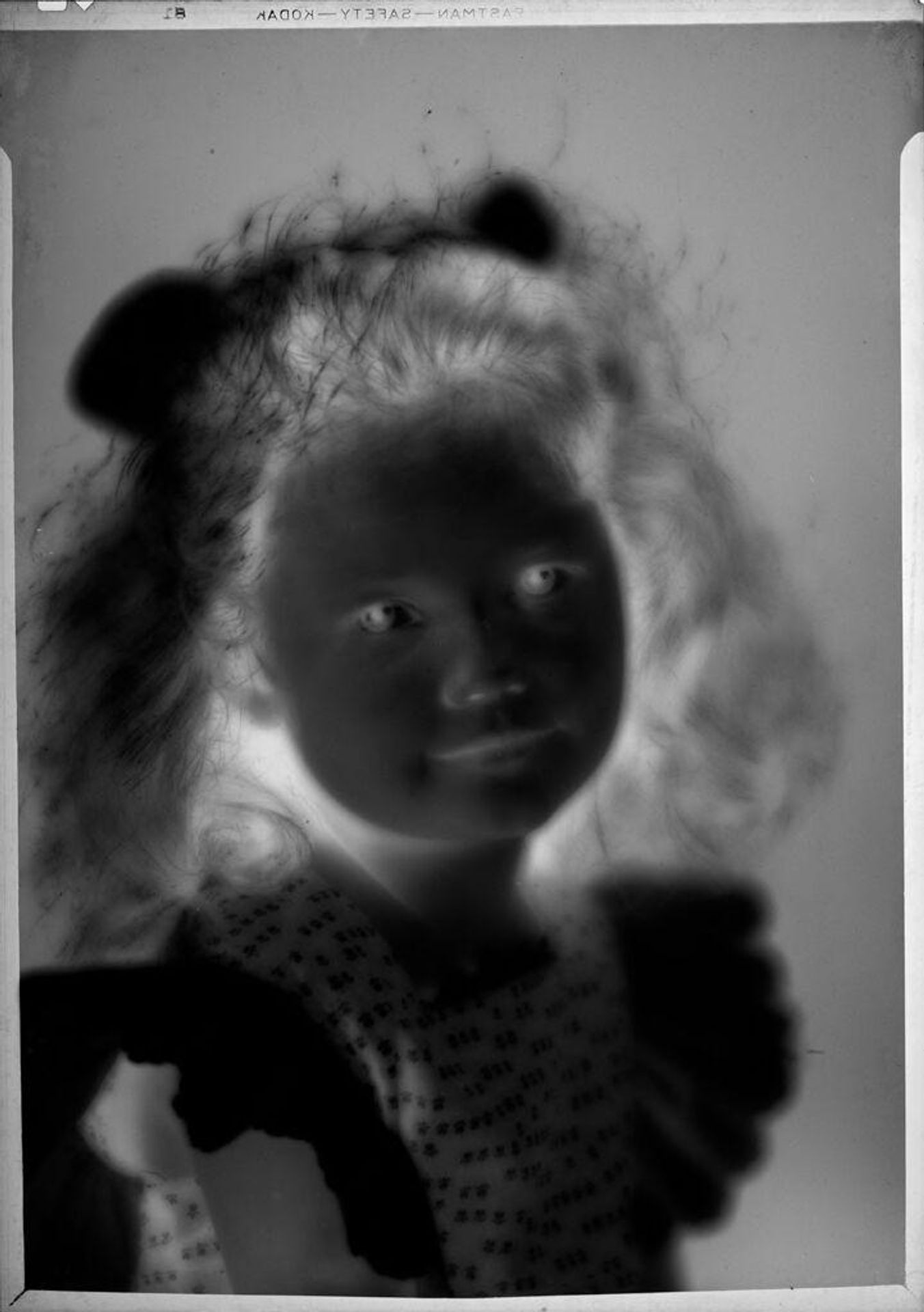 Untitled (soft-focus portrait of Eugenie Stoll) by C. Bennette Moore