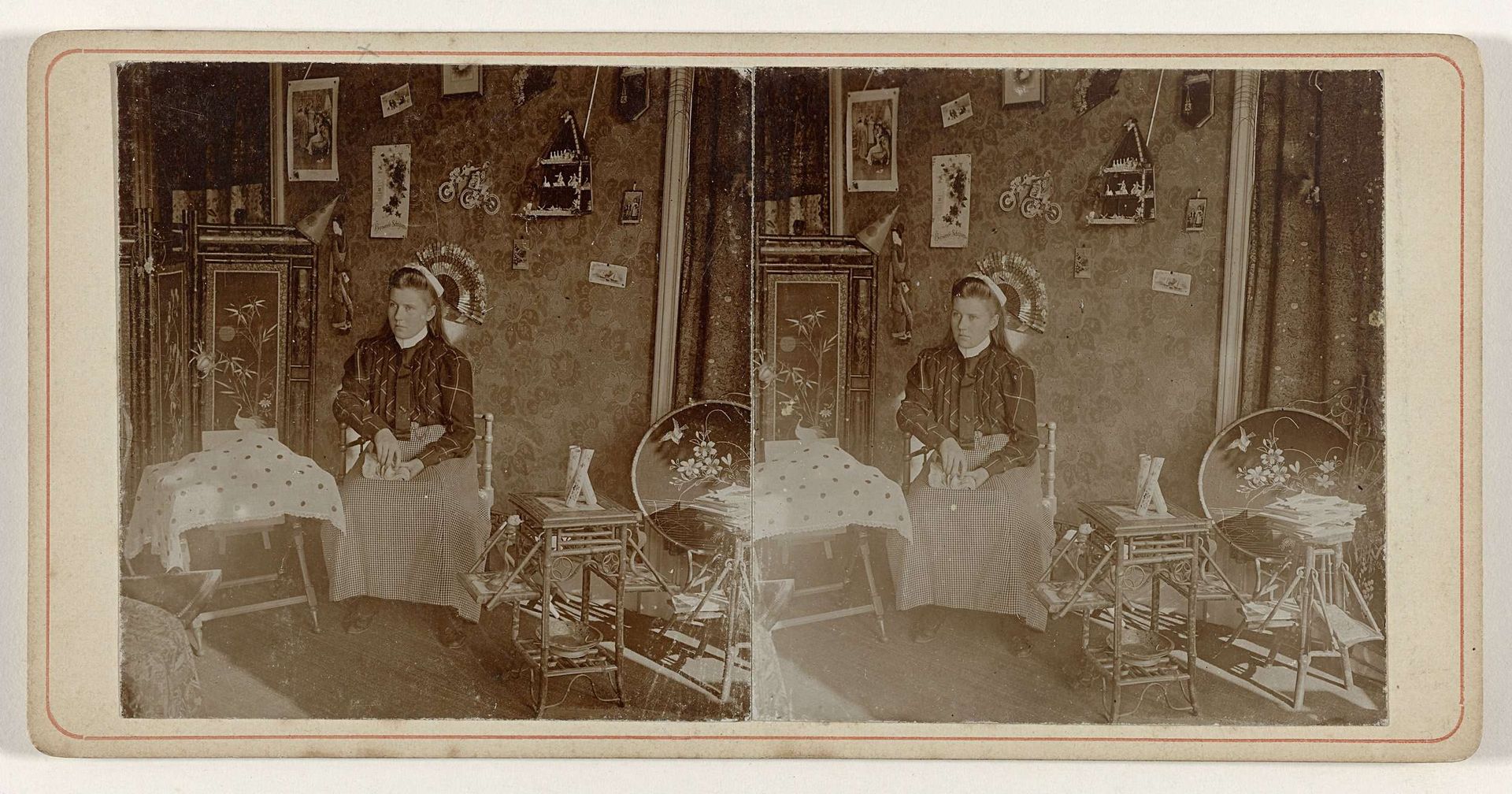 Portret van een jonge vrouw op een stoel in de huiskamer by Geldolph Adriaan Kessler