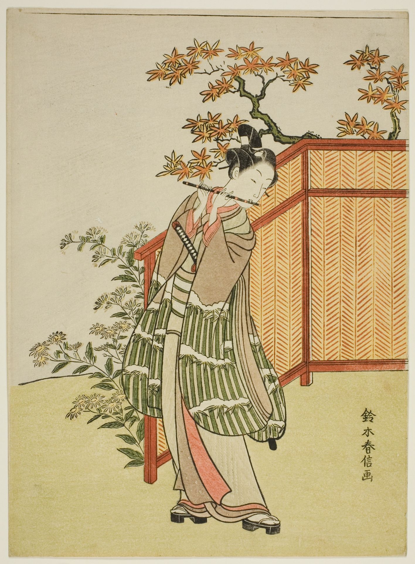 Young Man Playing the Flute Beside a Fence by Suzuki Harunobu 鈴木春信
