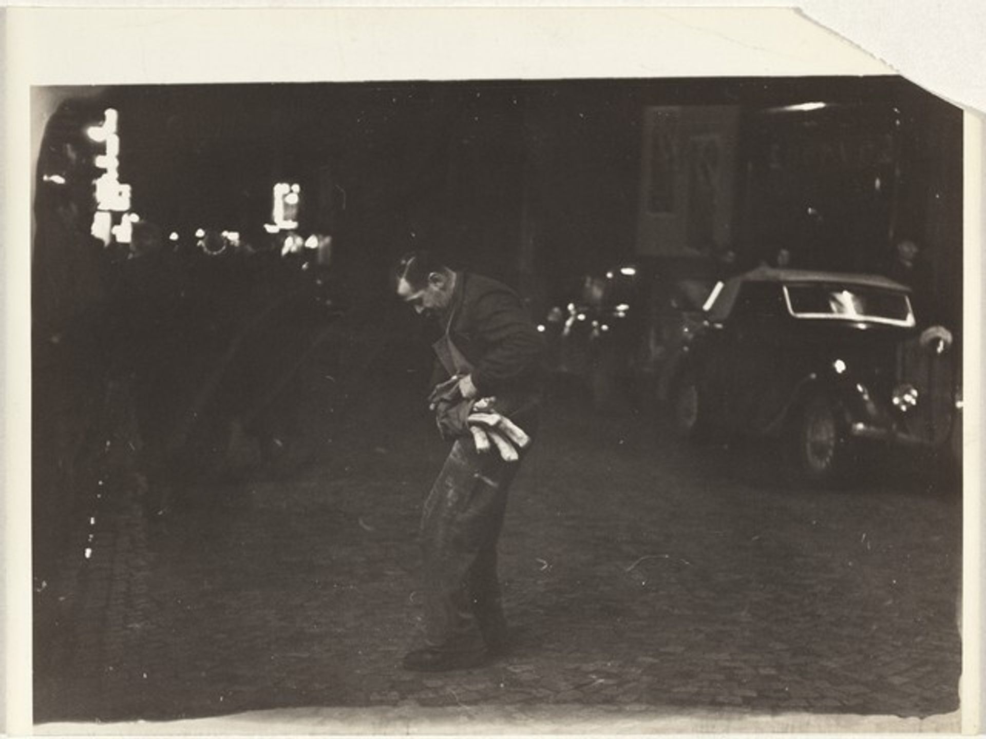 Man with baguettes in street, Paris by Robert Frank