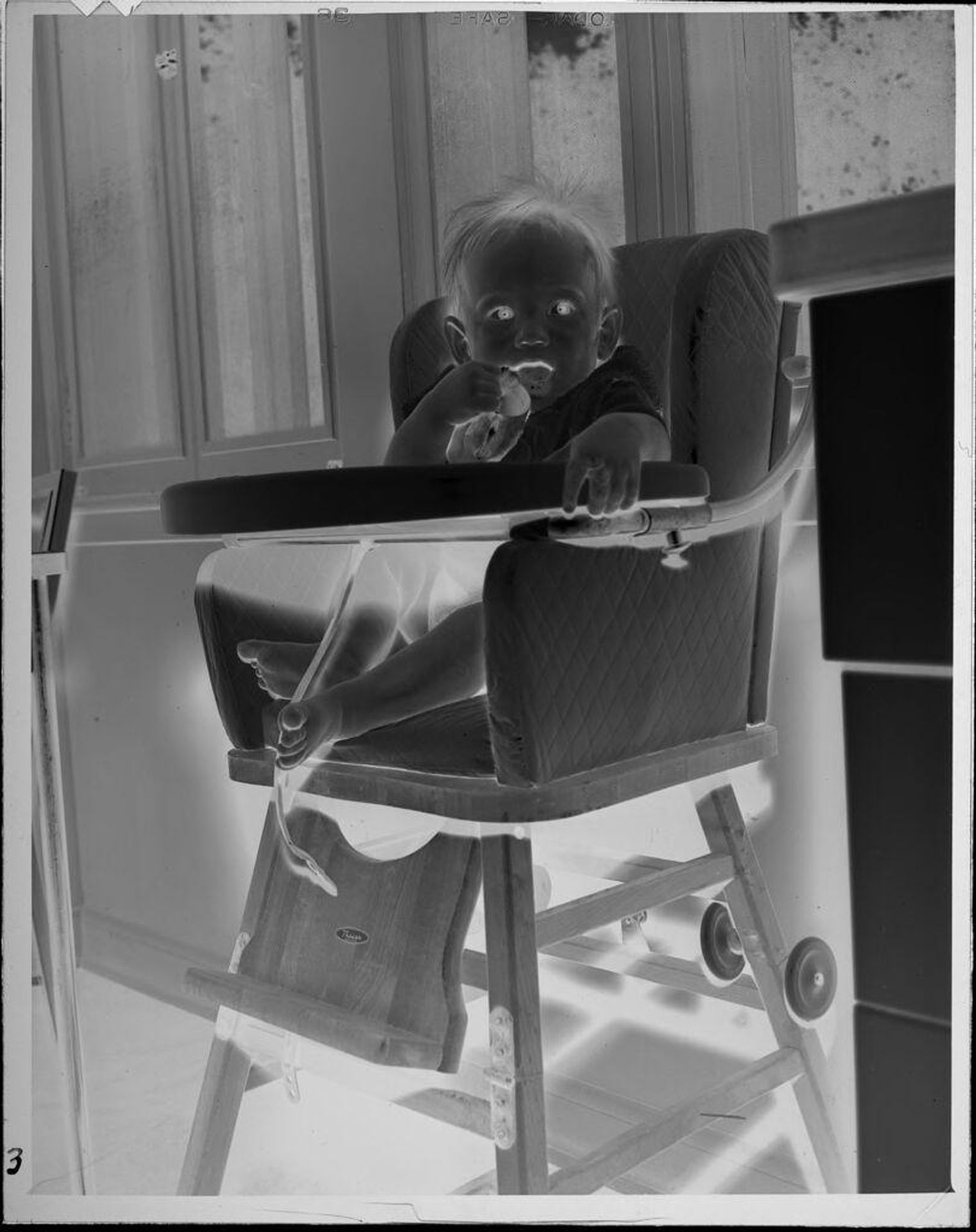 Untitled (baby in high chair) by Lucian and Mary Brown