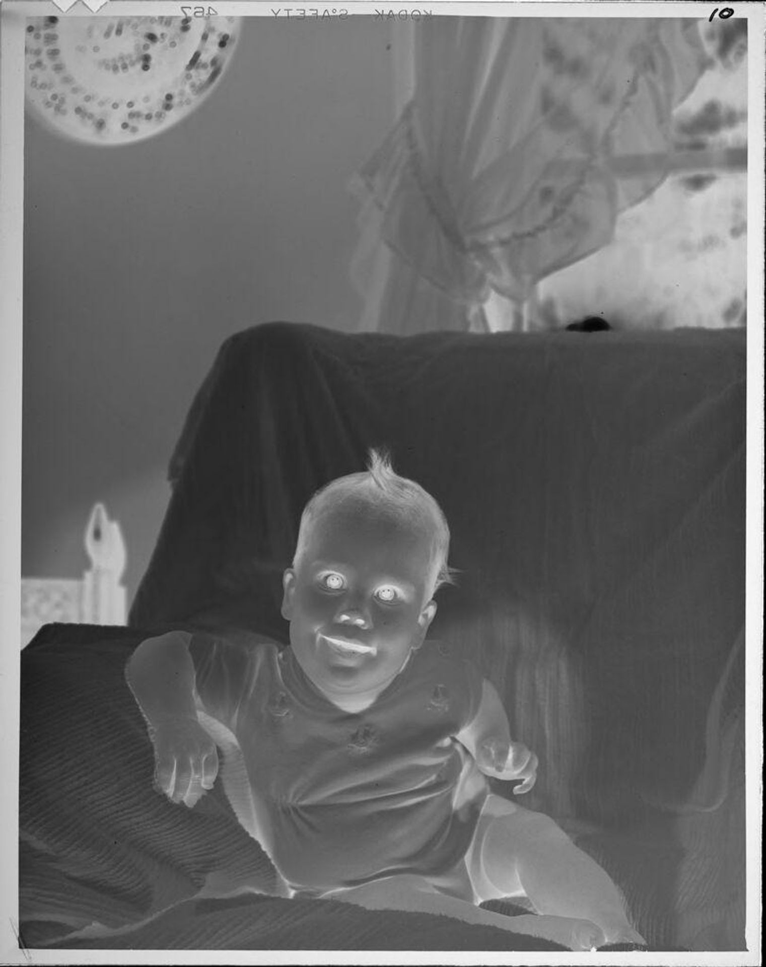 Untitled (baby on chair) by Lucian and Mary Brown