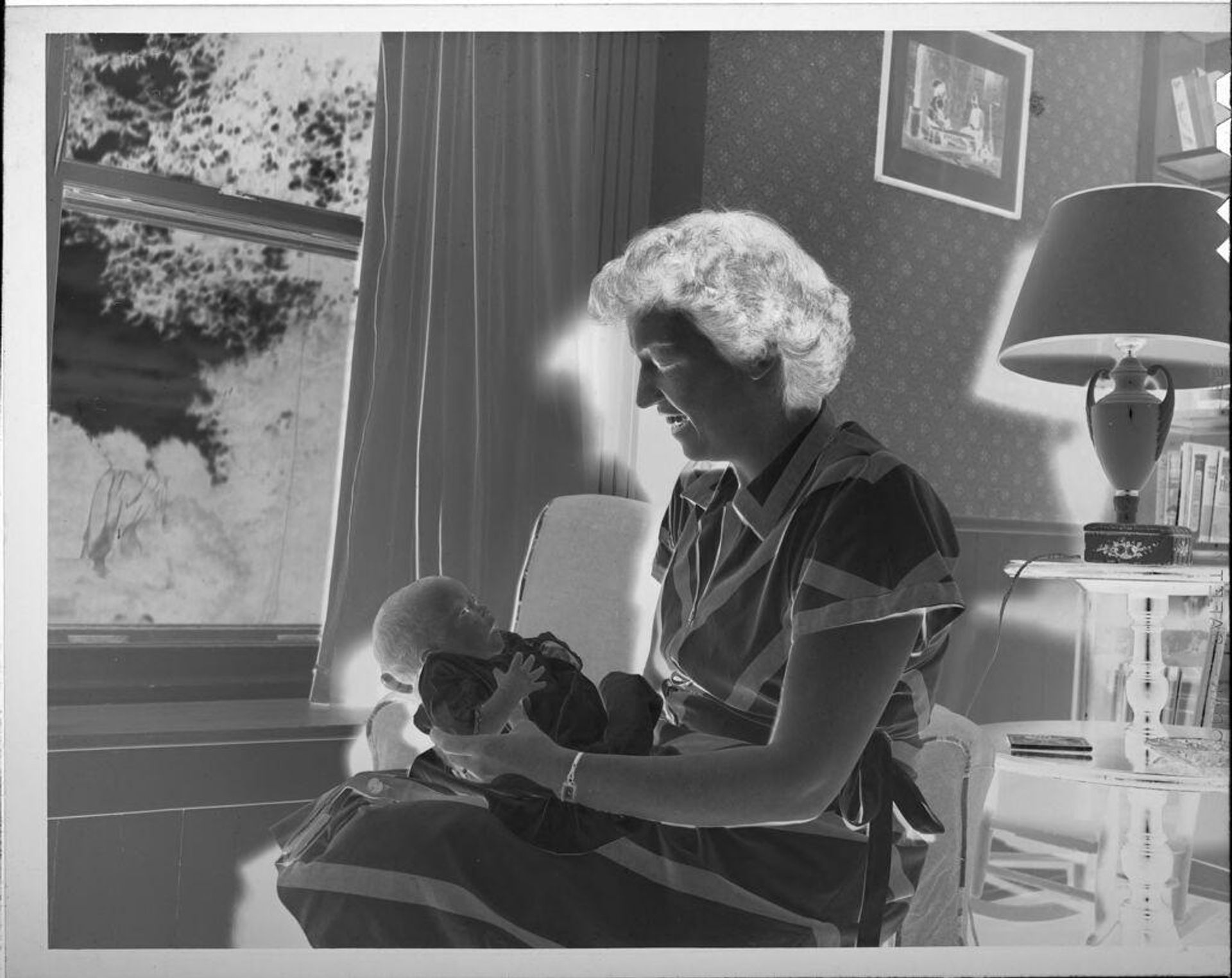 Untitled (seated woman holding baby) by Lucian and Mary Brown