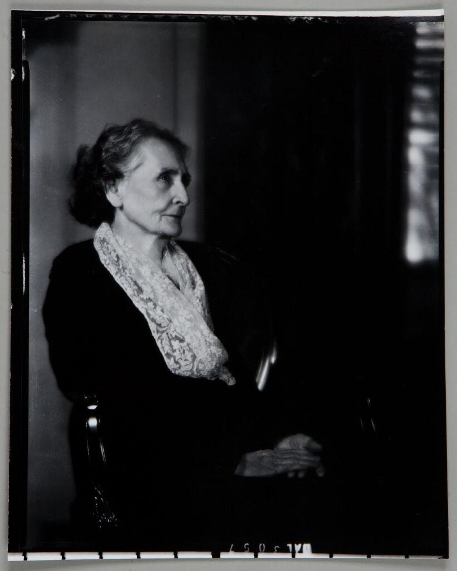 Untitled (portrait of older woman seated in chair with lacy scarf and hands on lap) by Paul Gittings