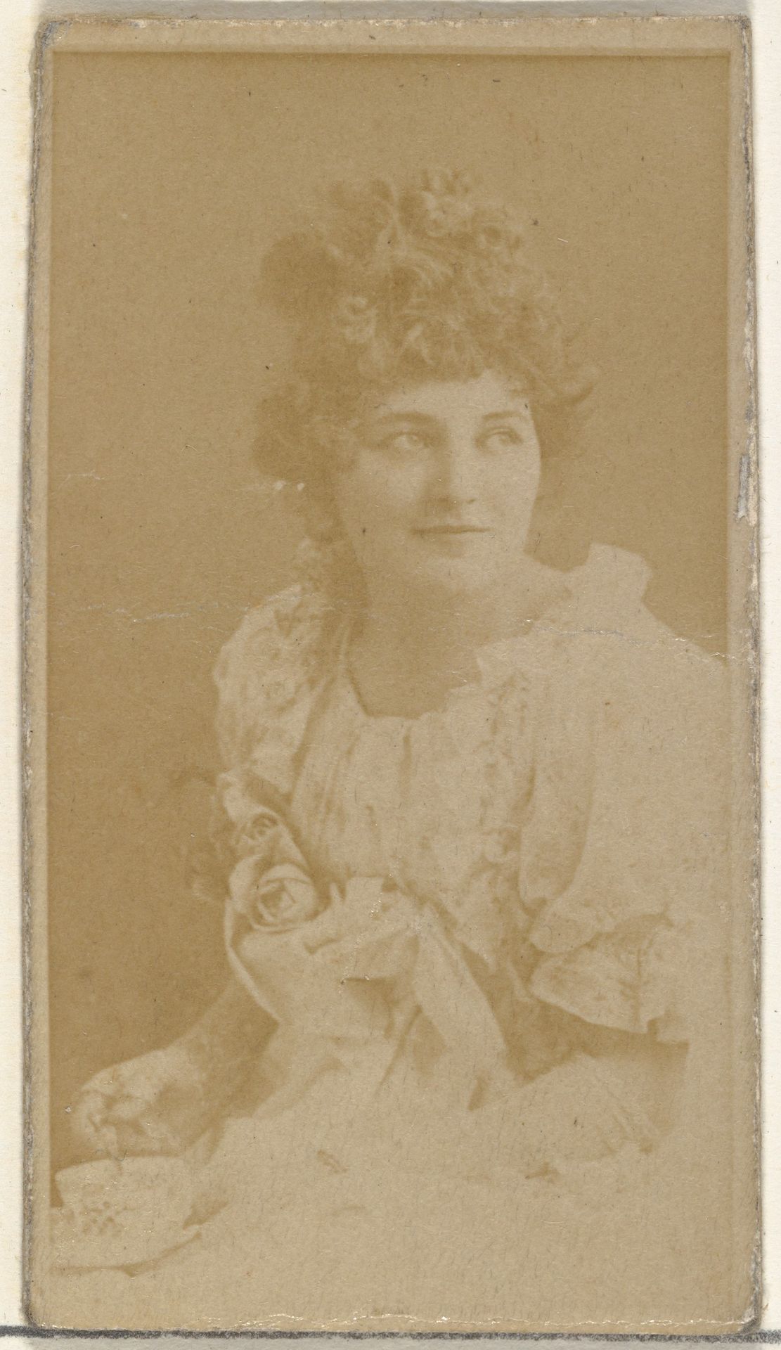 [Actress holding teacup], from the Actors and Actresses series (N145-8) issued by Duke Sons & Co. to promote Duke Cigarettes by W. Duke, Sons & Co.