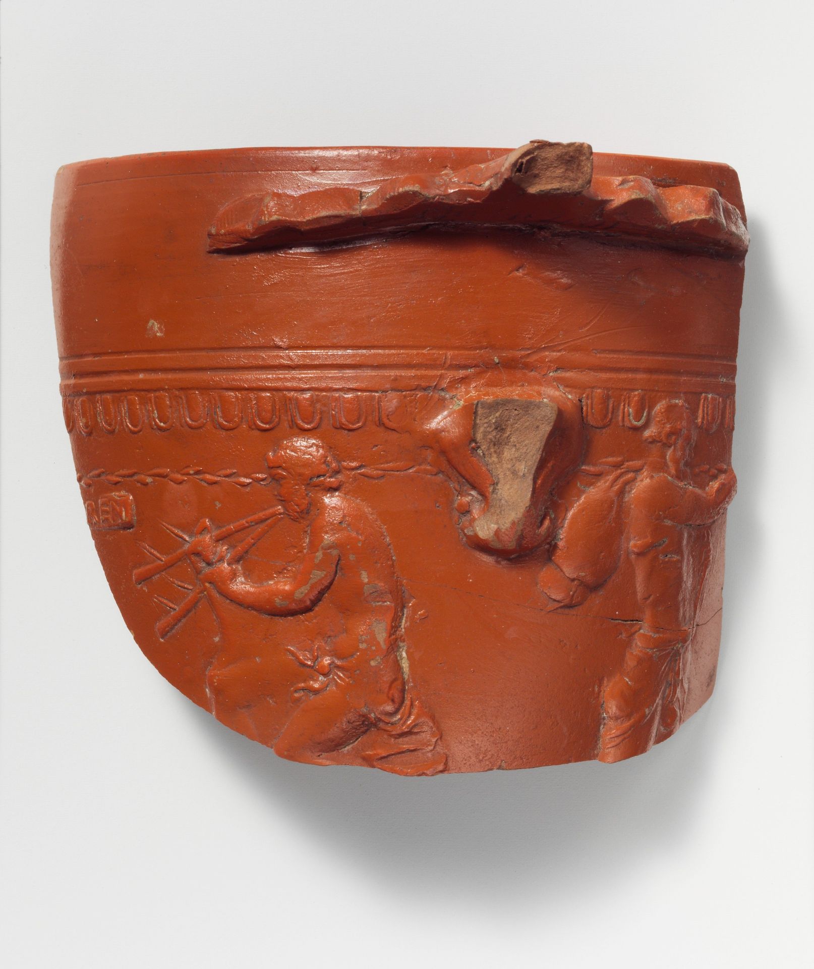 Terracotta fragment of an Arretine cup with satyrs by Perennius