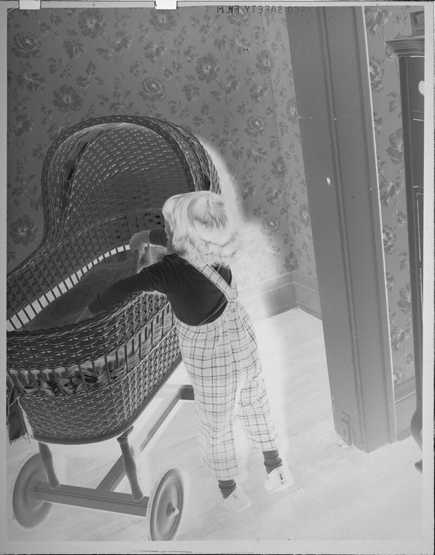 Untitled (little girl and bassinet) by Lucian and Mary Brown