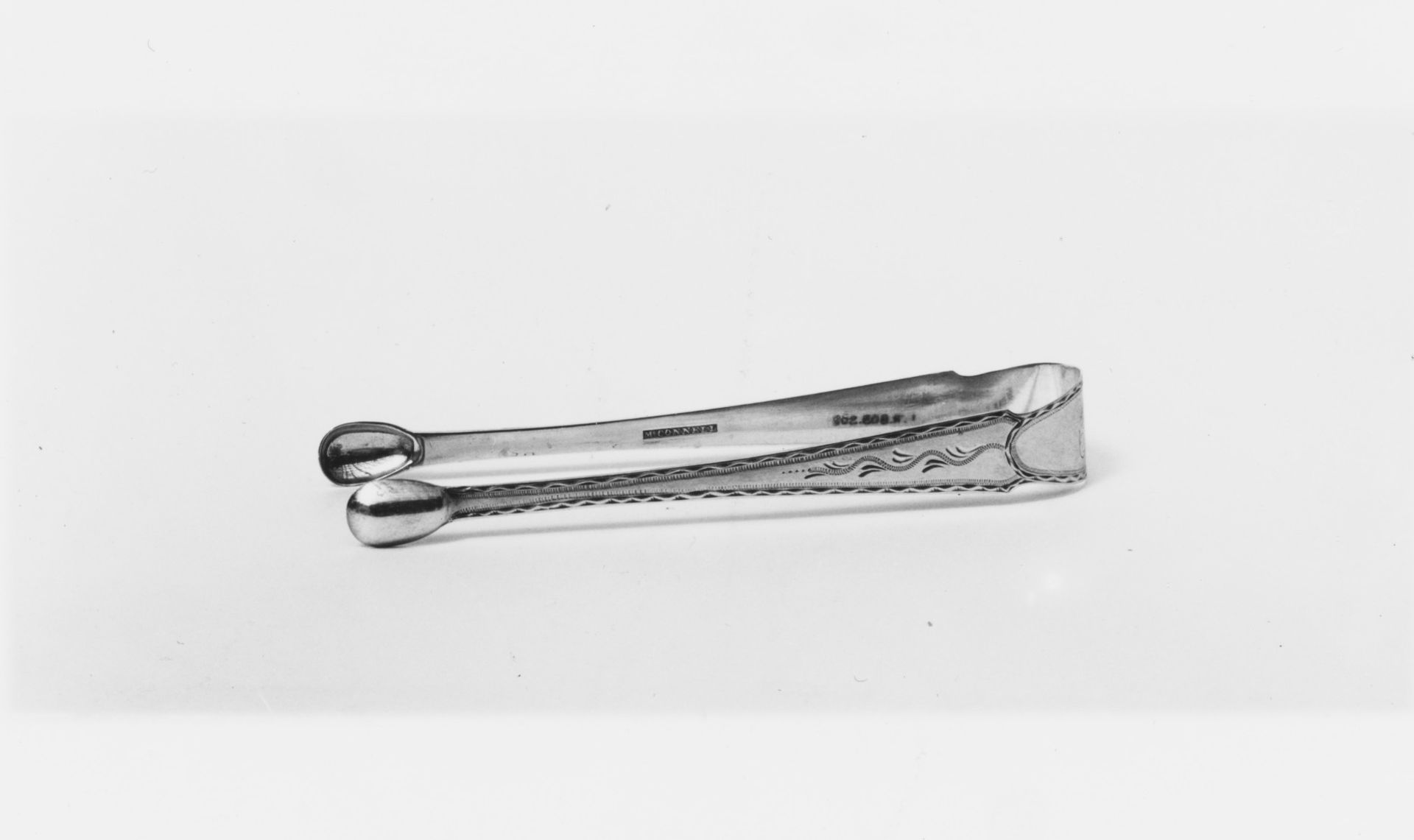 Tongs by M. Connell