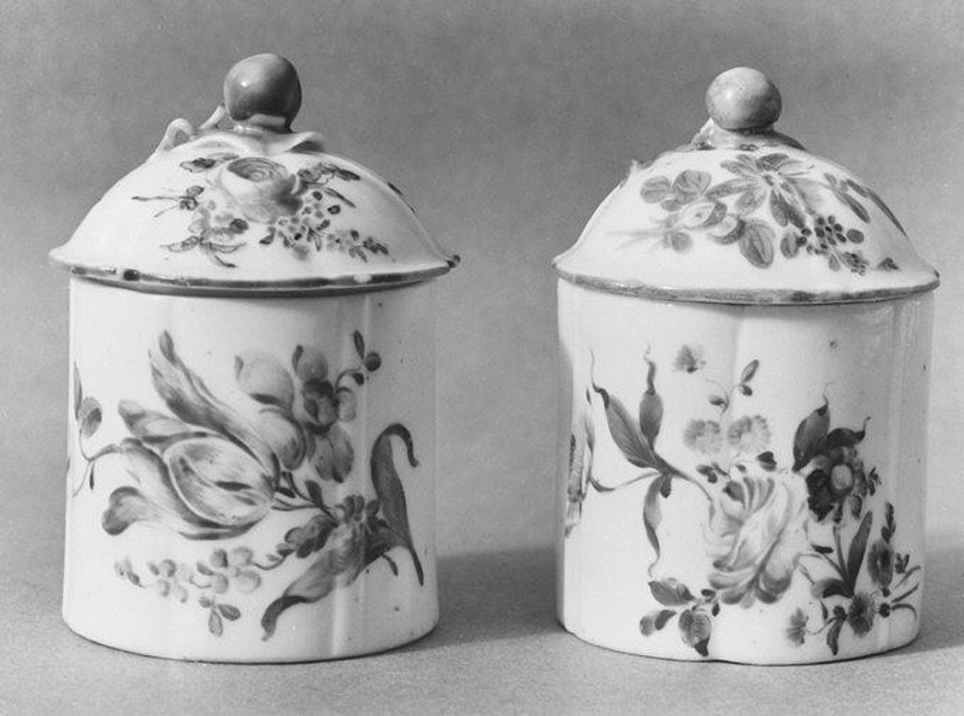 Pair of pomade jars with covers by Mennecy