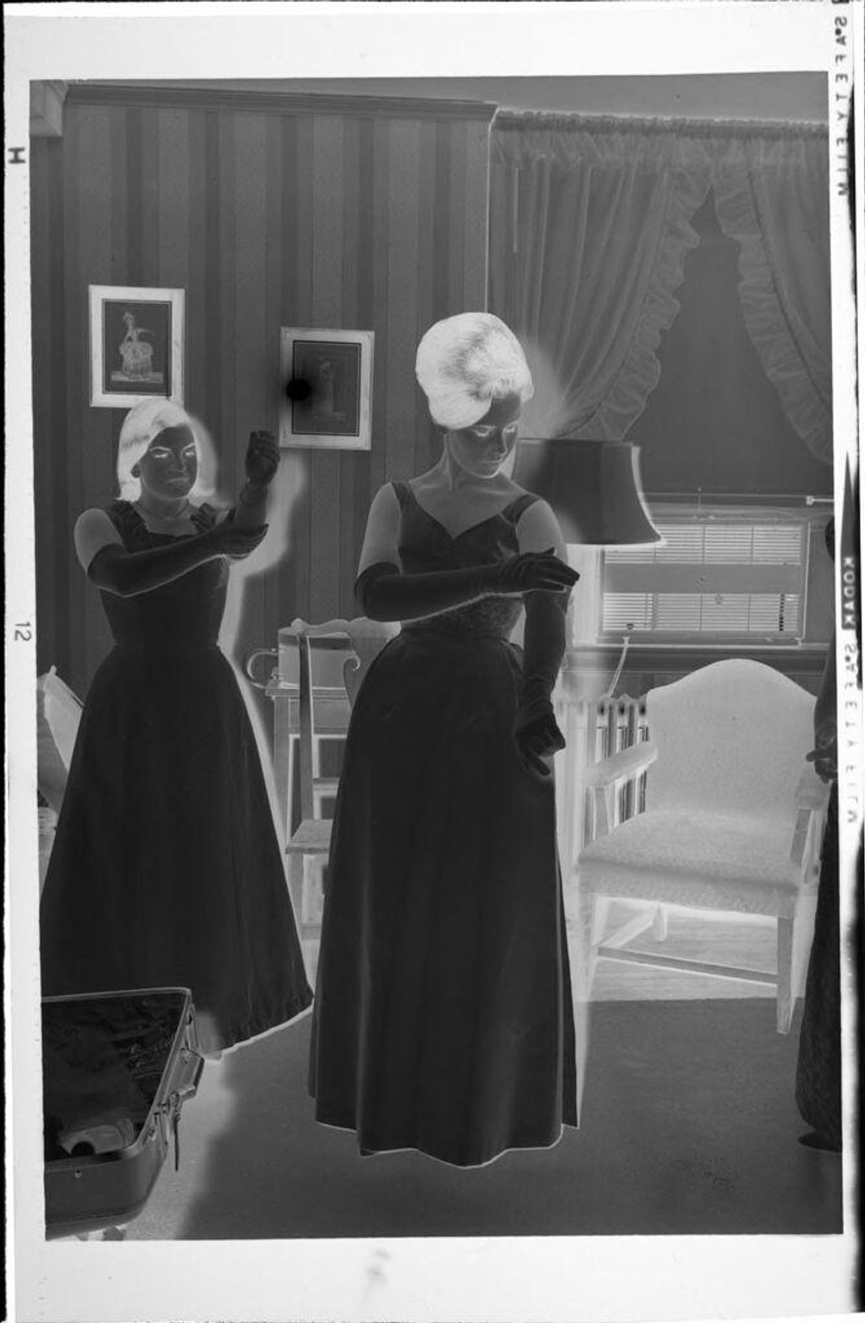 Untitled (women putting on gloves) by Robert Burian