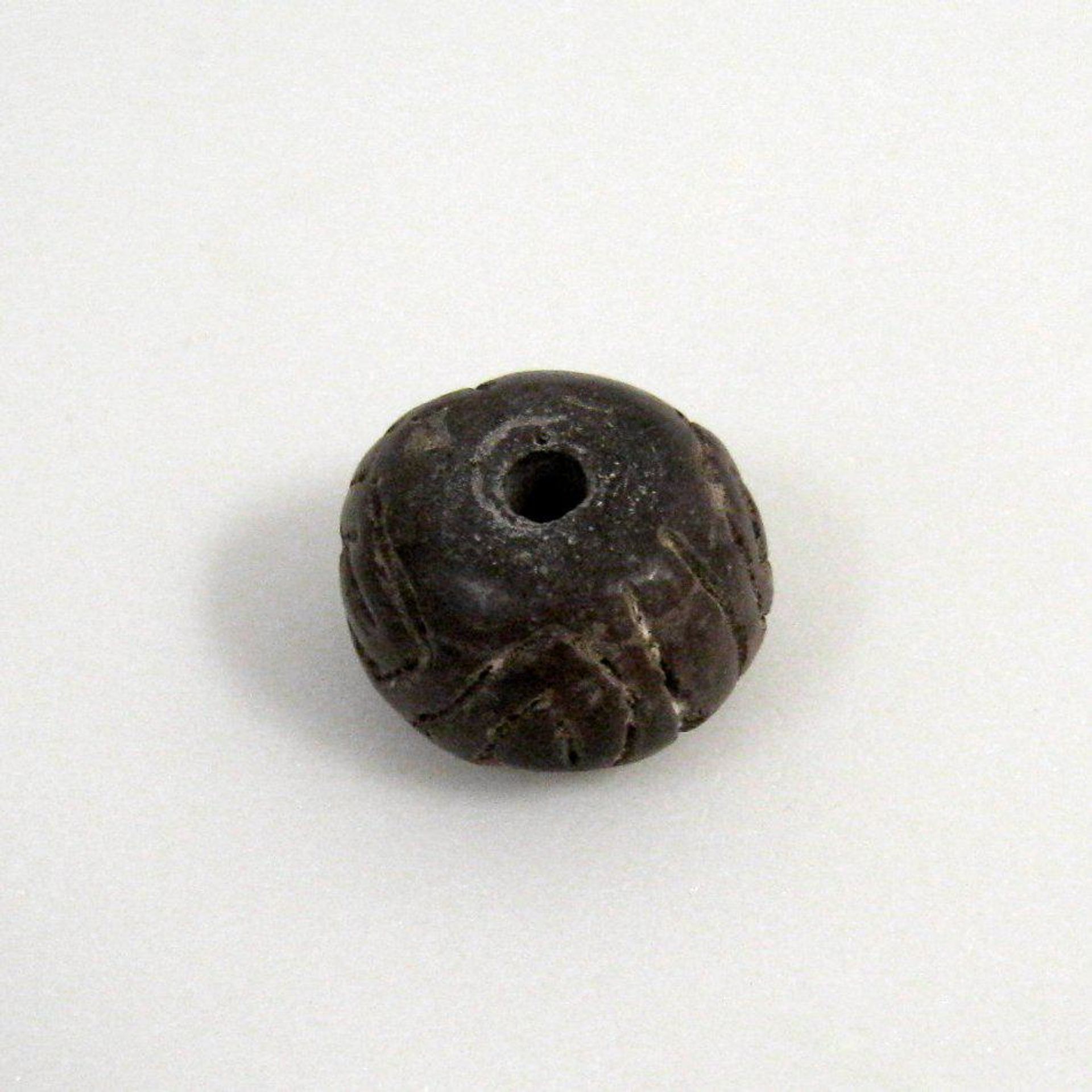 Spindle Whorl by Anonymous