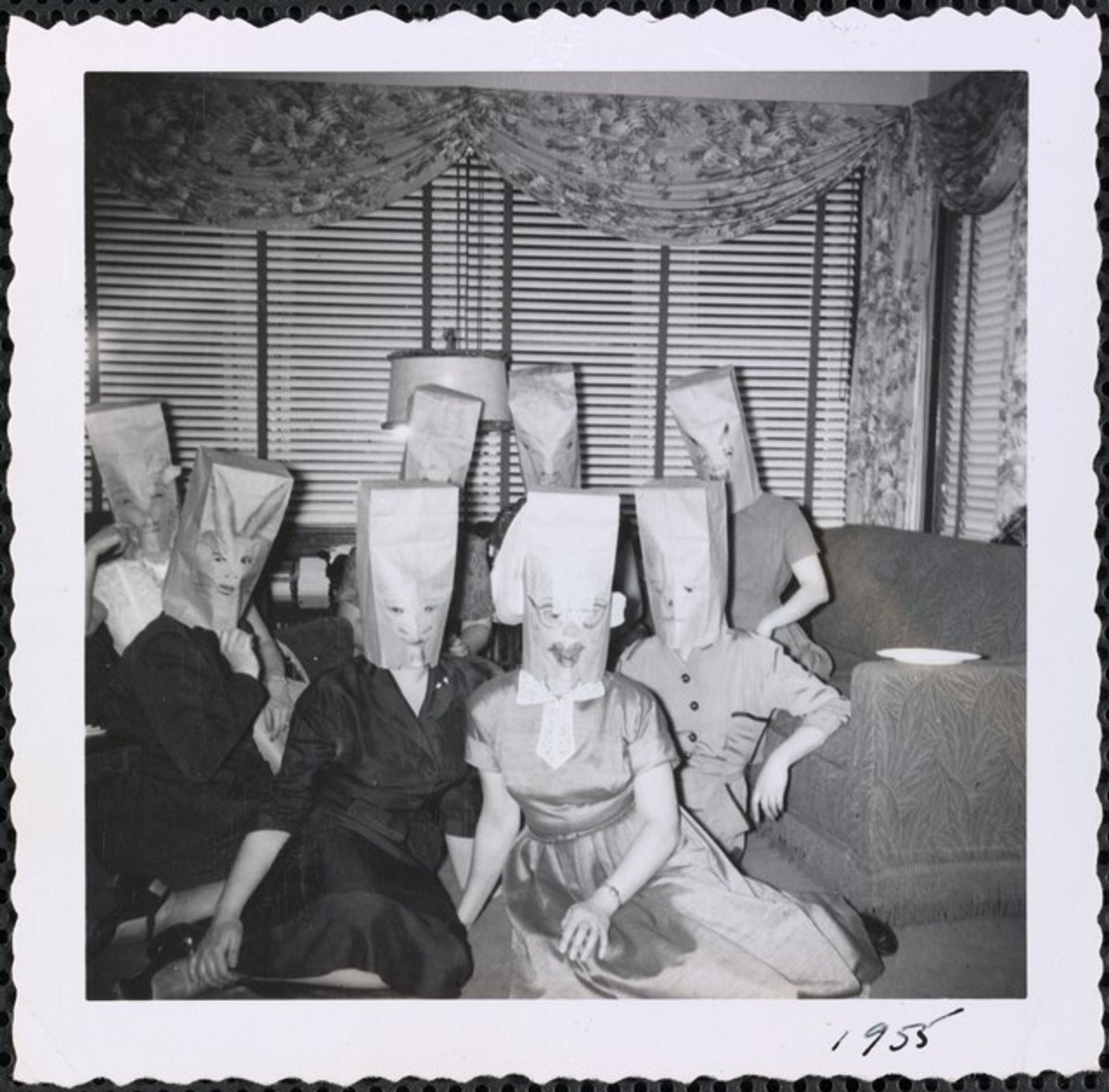 Untitled (Women with paper bags over heads) by Anonymous