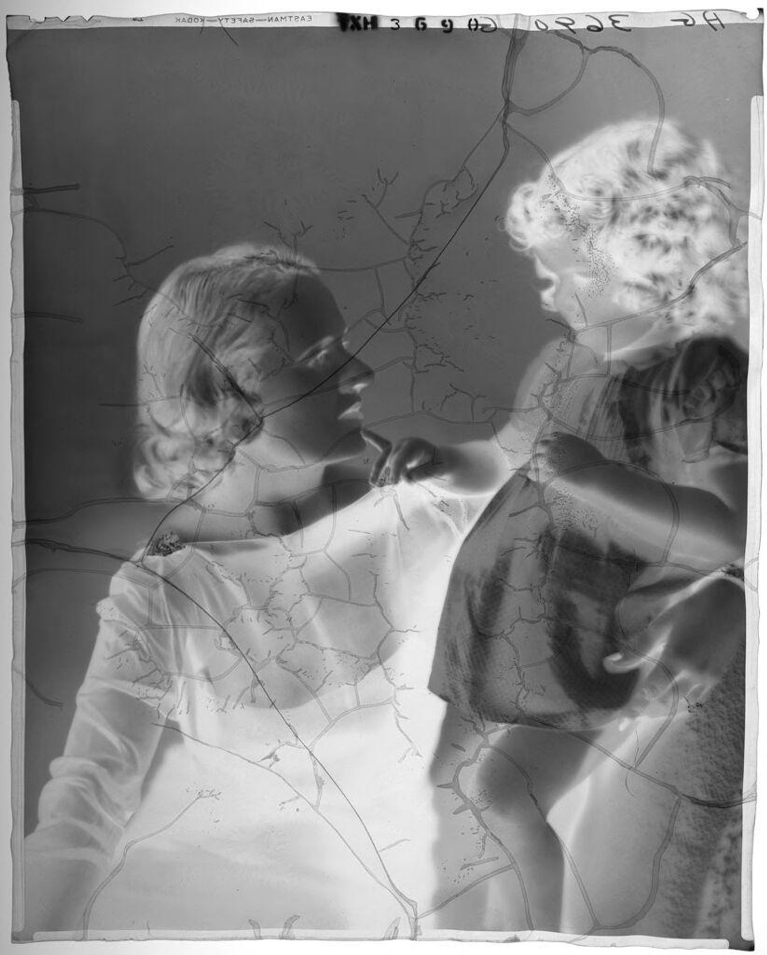 Untitled (young woman seated with arm around standing little girl) by Paul Gittings