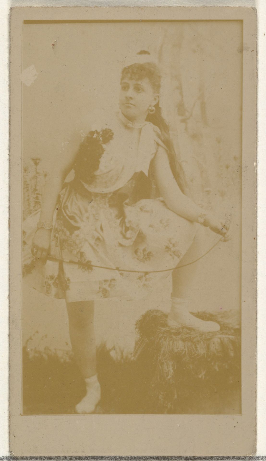 [Actress posing with foot on stool], from the Actors and Actresses series (N145-8) issued by Duke Sons & Co. to promote Duke Cigarettes by W. Duke, Sons & Co.