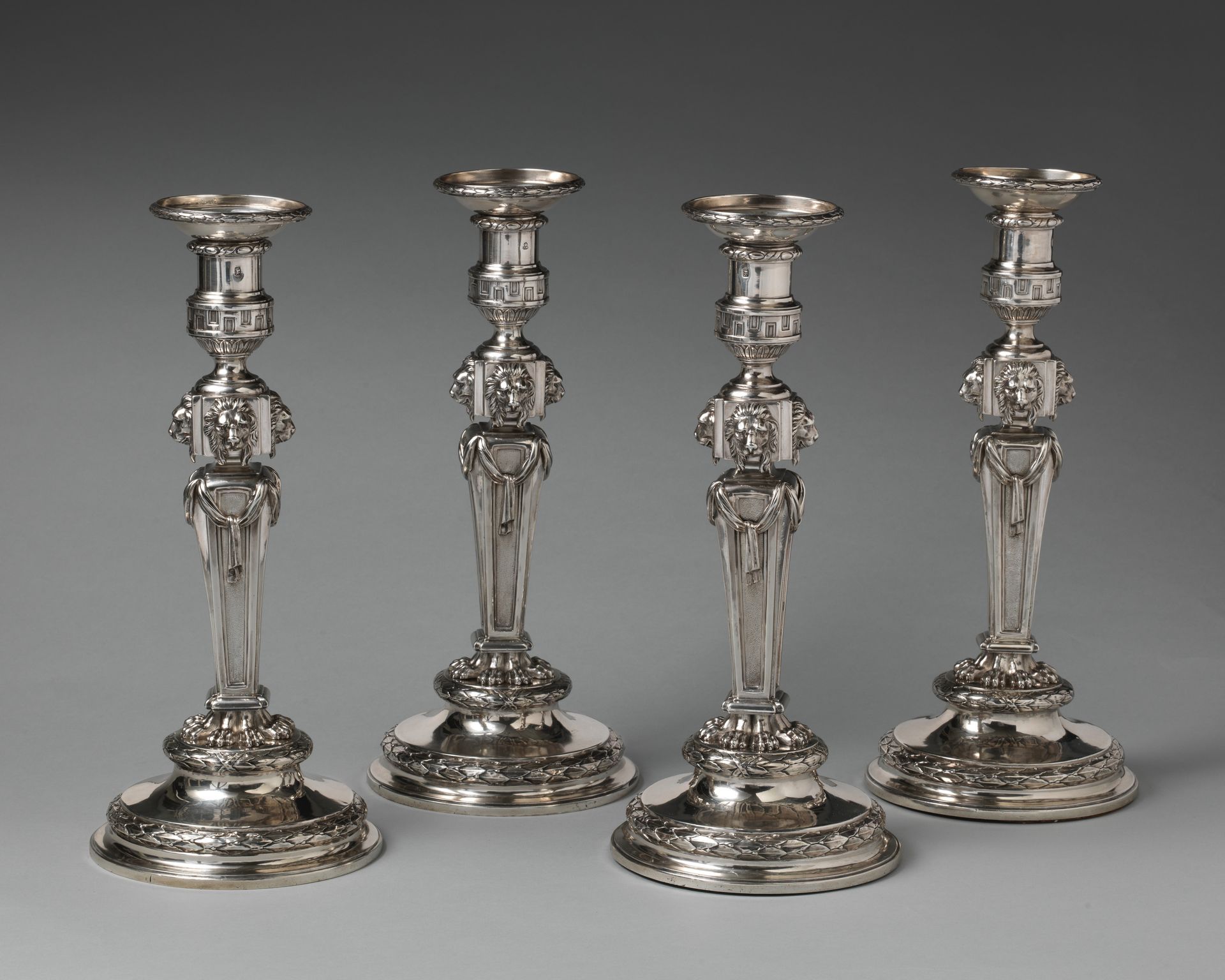 Set of four candlesticks by Thomas Heming