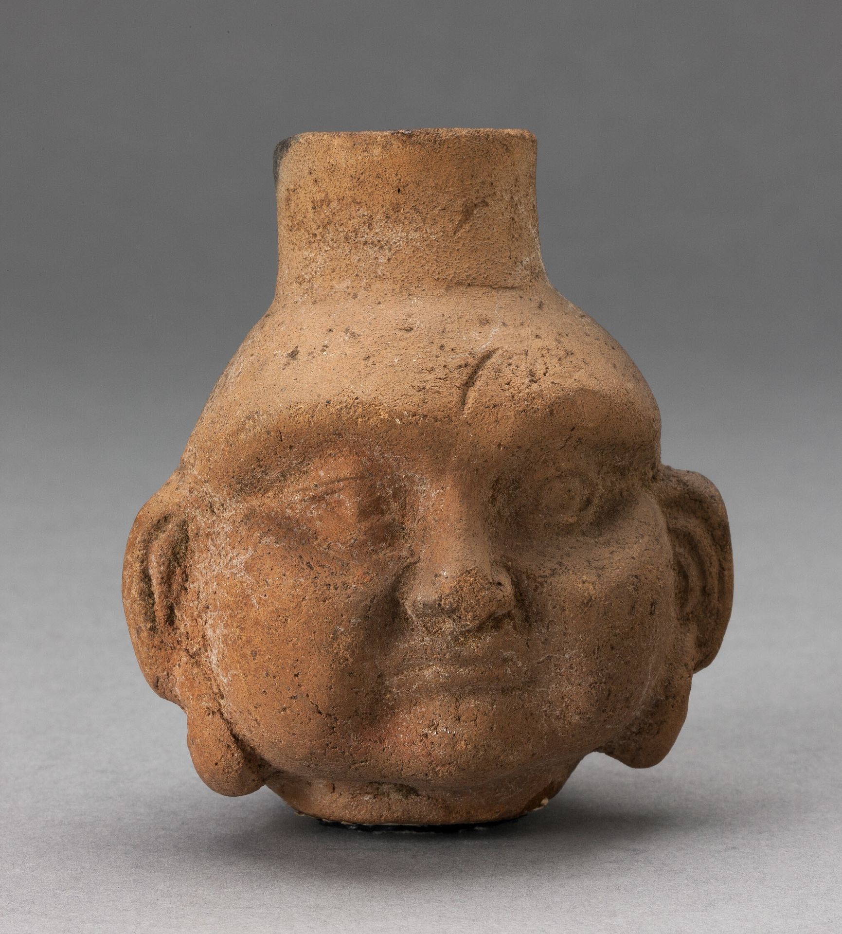 Miniature Jar in Form of Human Head with Large Cheeks by Moche