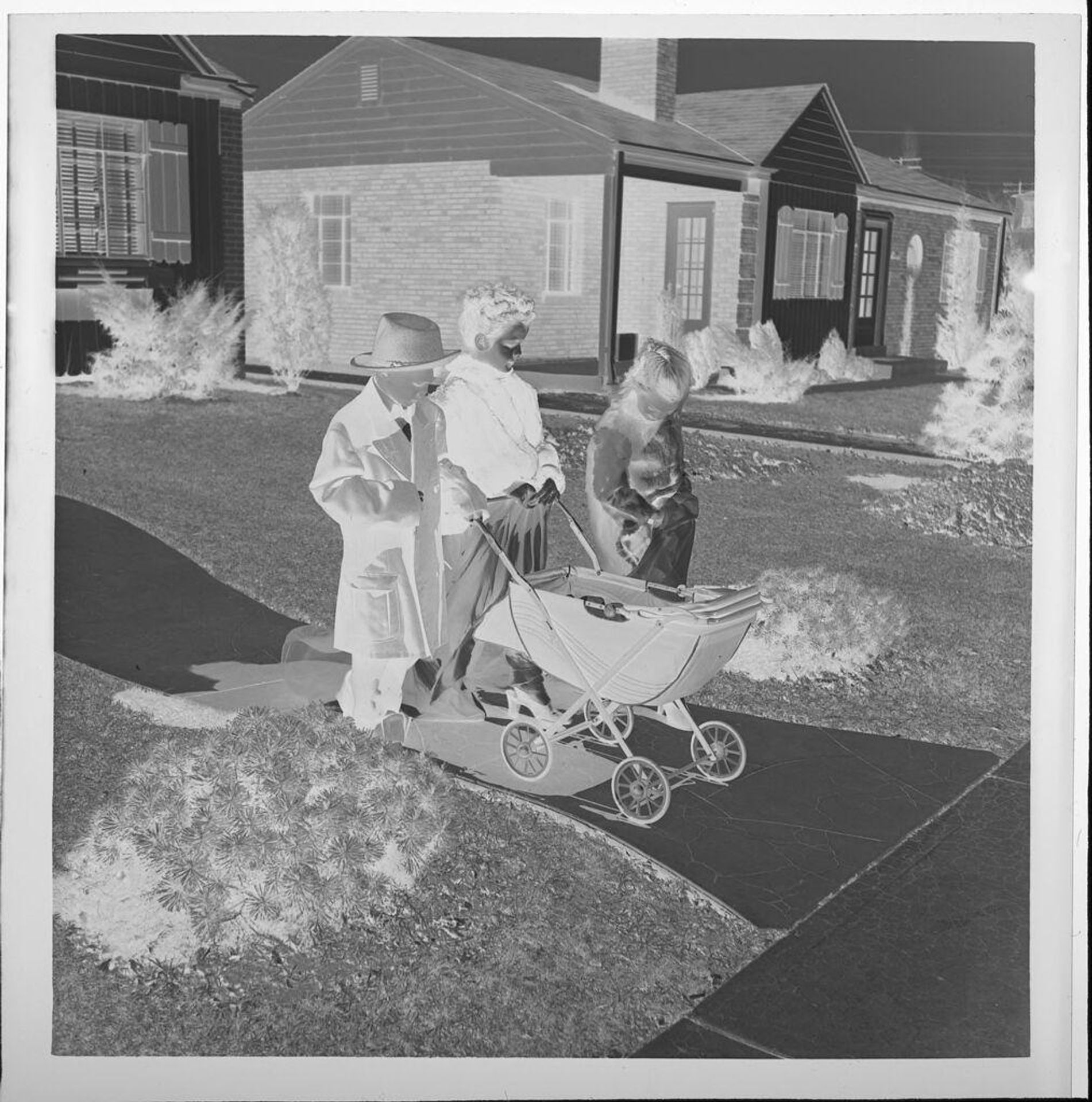 Untitled (children playing dress-up and walking baby carraige on sidewalk) by Jack Gould