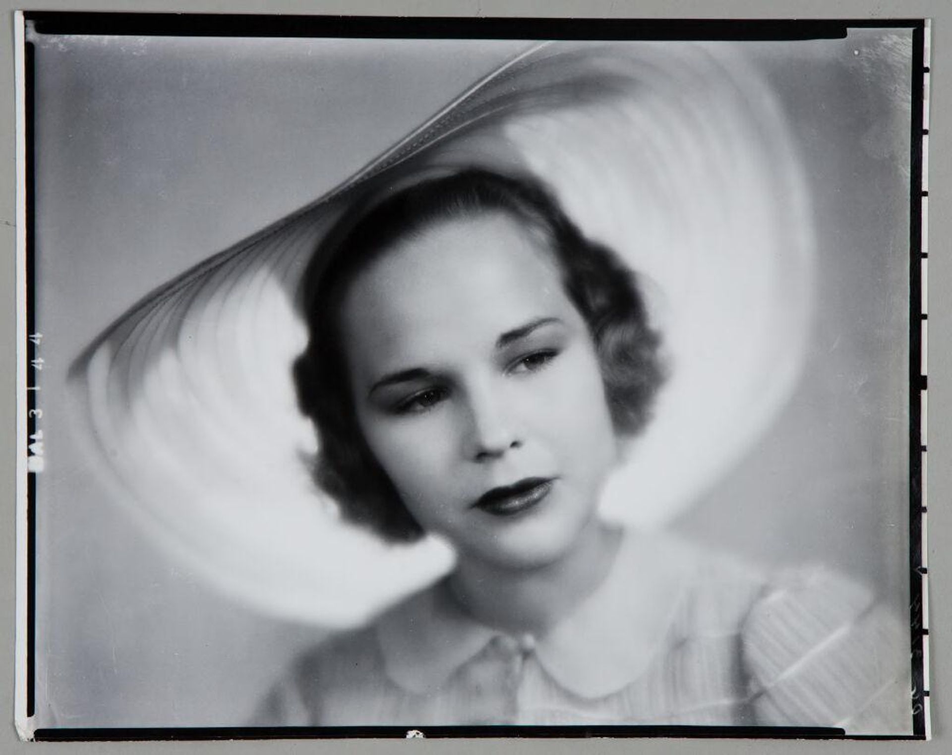 Untitled (portrait of woman in large white hat) by Paul Gittings