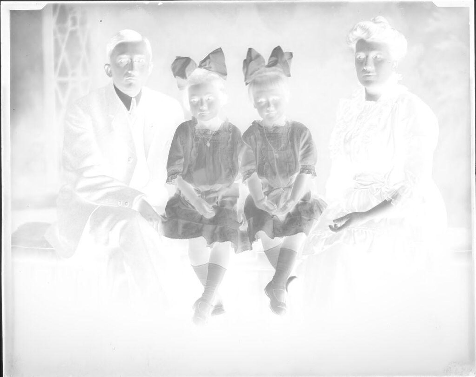 Untitled (portrait of parents with two girls) by Hamblin Studio