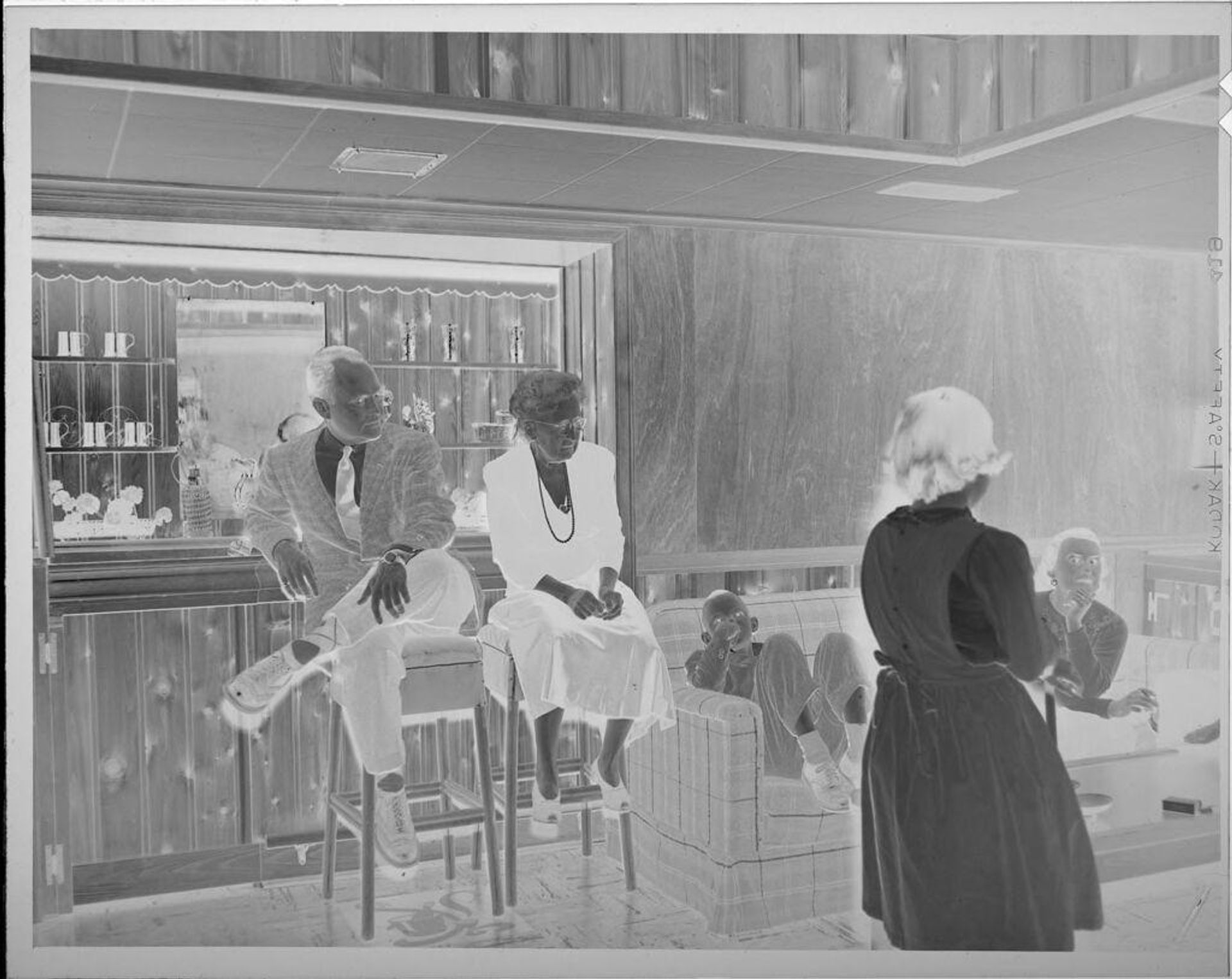Untitled (family in rec room) by Lucian and Mary Brown