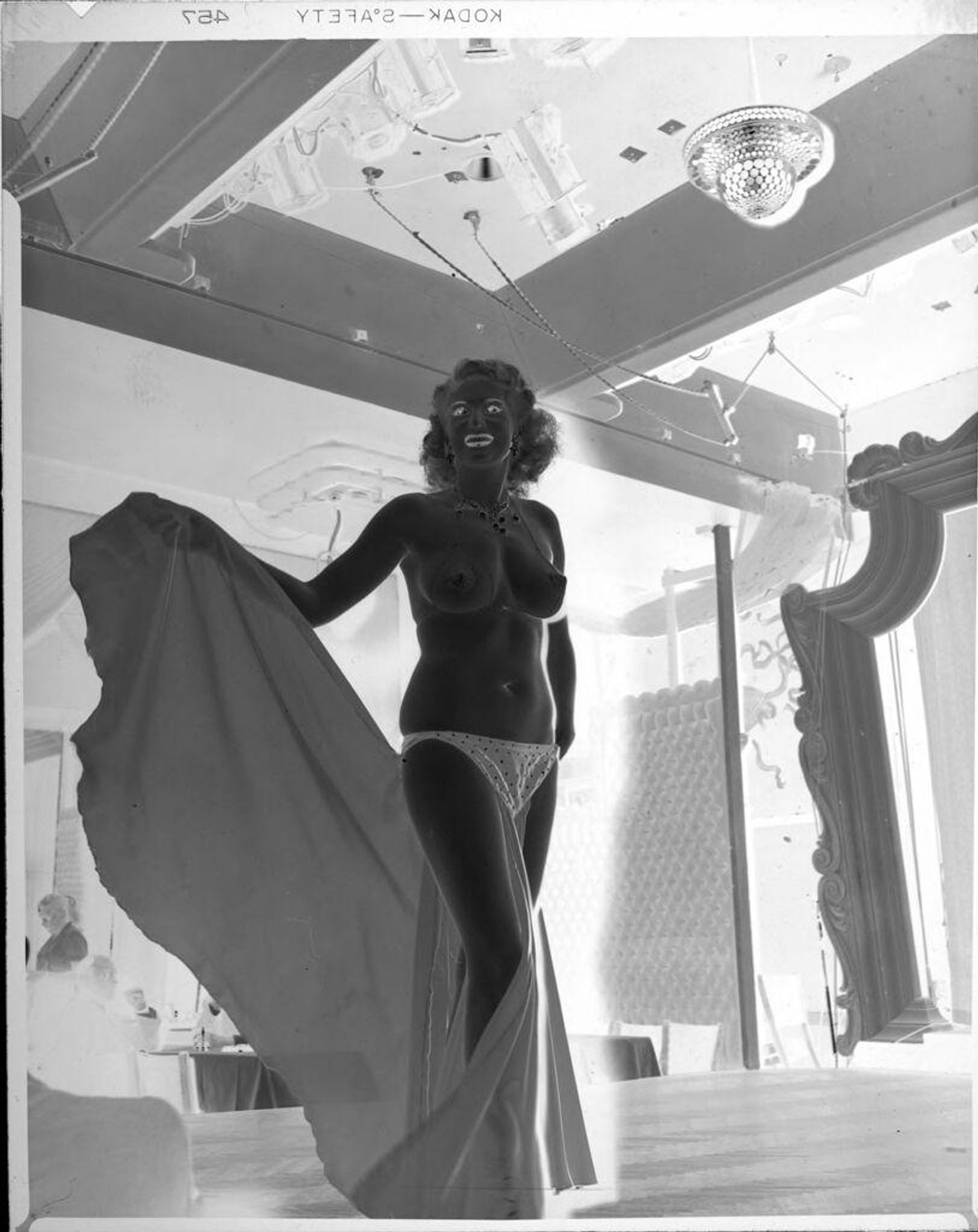 Untitled (semi-nude dancer onstage) by Peter James Studio