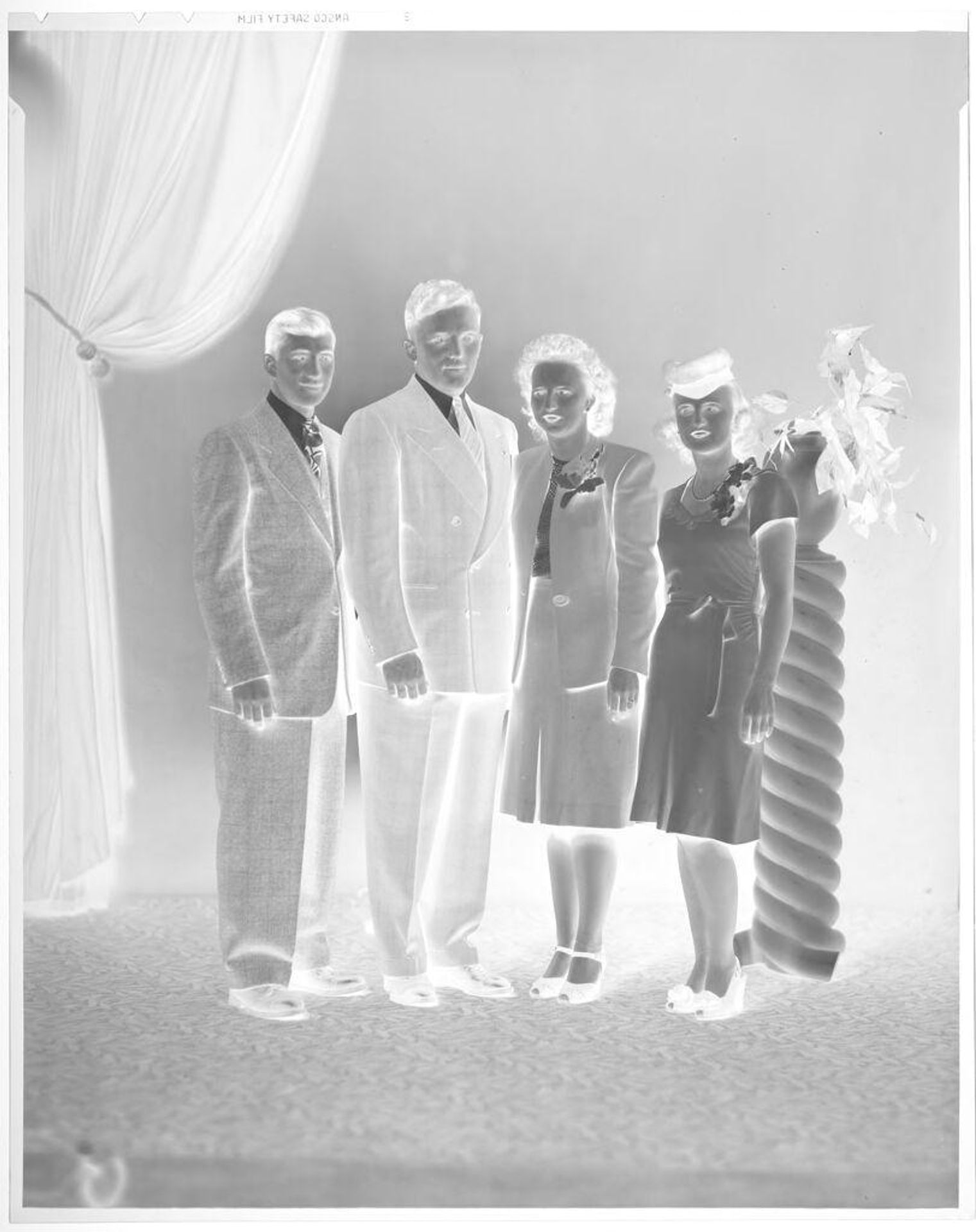 Untitled (two men and two women posed in studio) by John Deusing