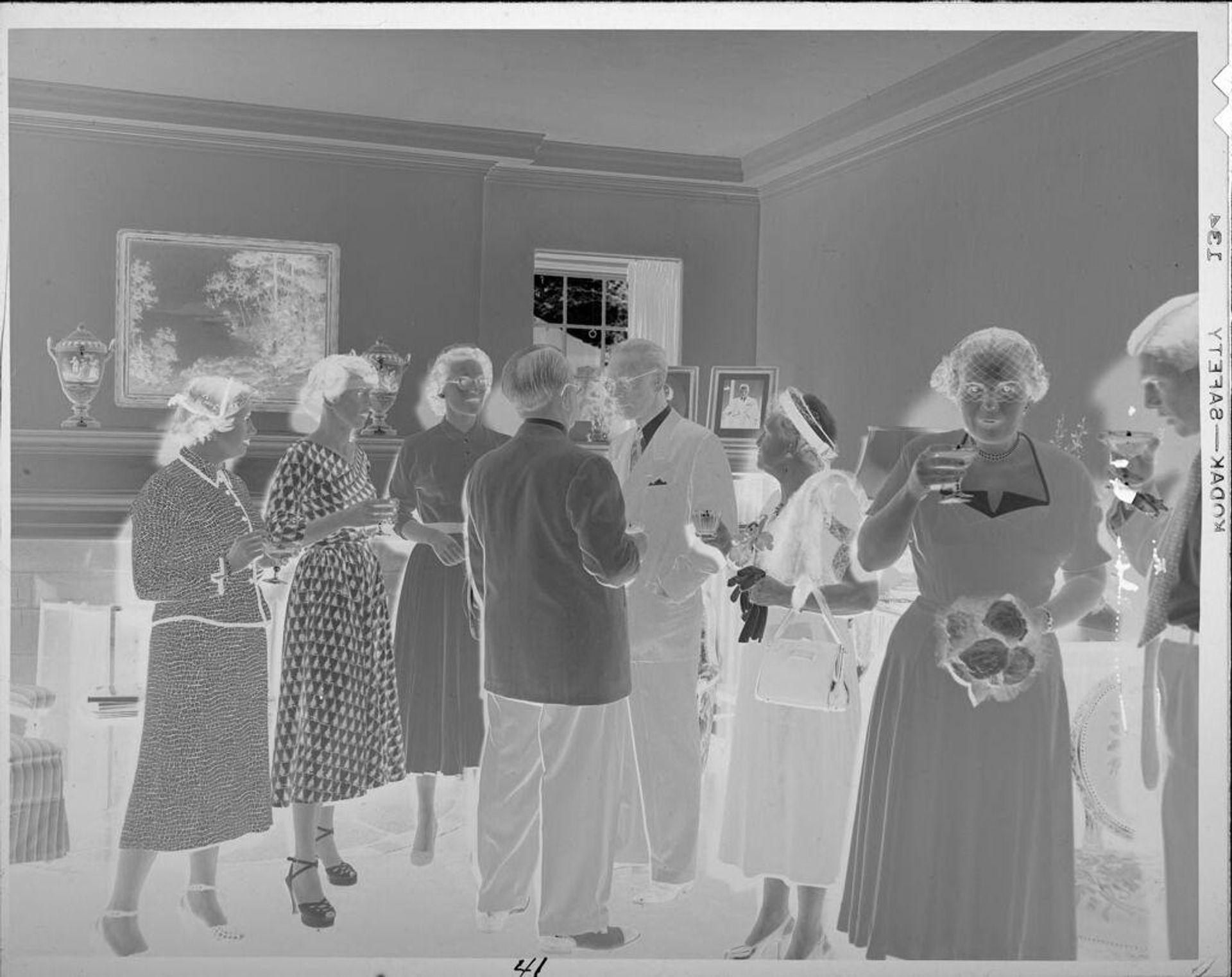 Untitled (ladies and gentlemen standing and drinking) by Lucian and Mary Brown