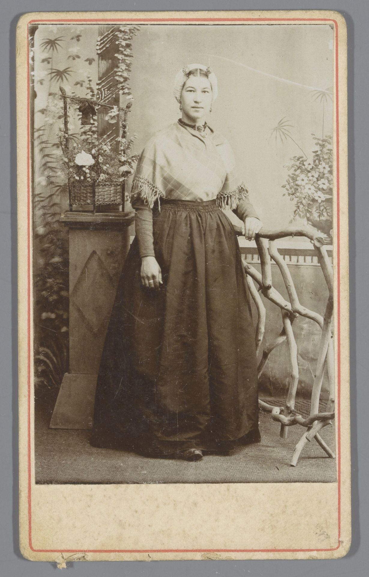 Portret van een onbekende jonge vrouw in Scheveningse klederdracht by Johannes van Schip