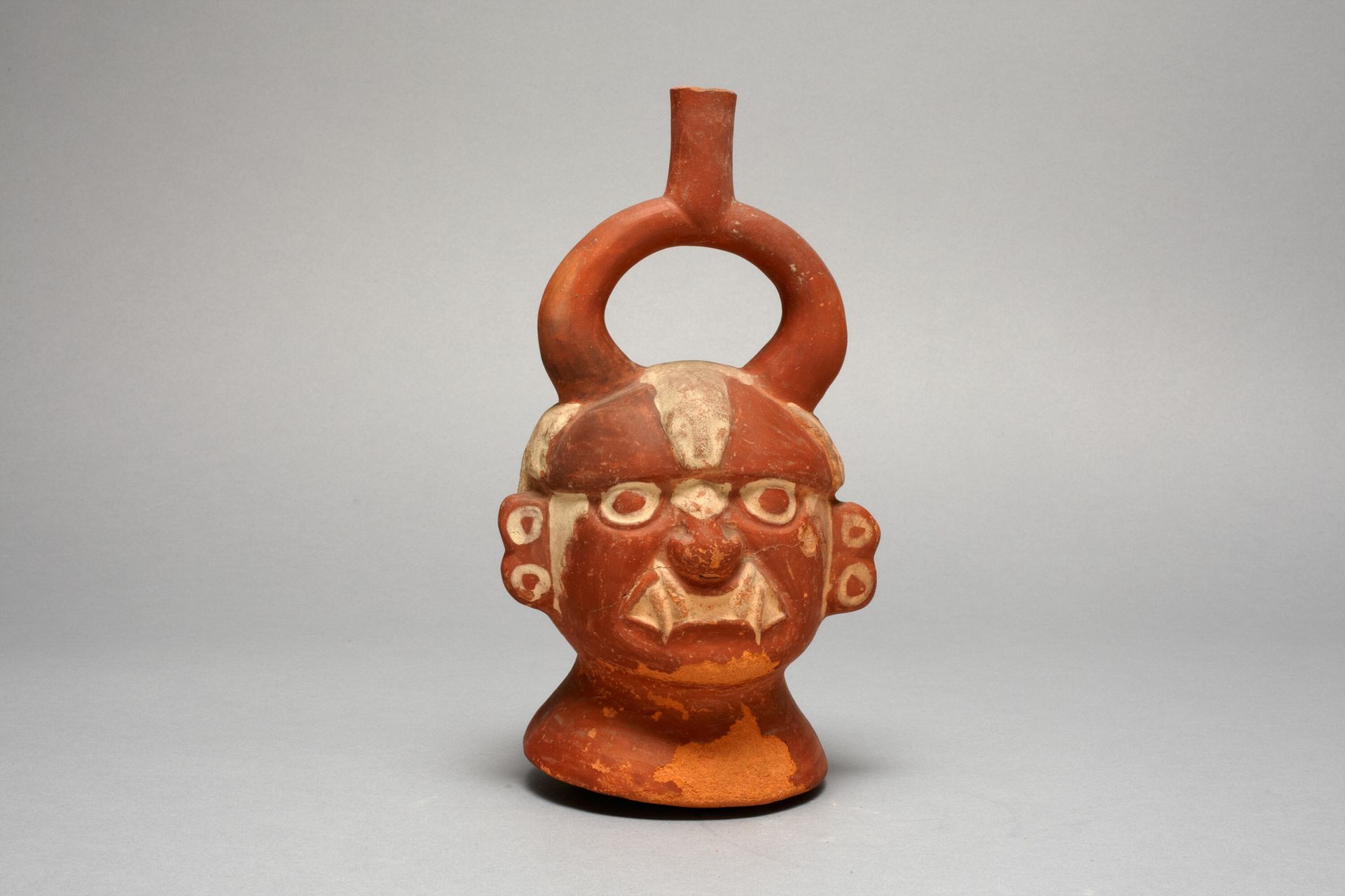 Stirrup Vessel in the Form of the Head, Possibly Ai-Apec by Moche