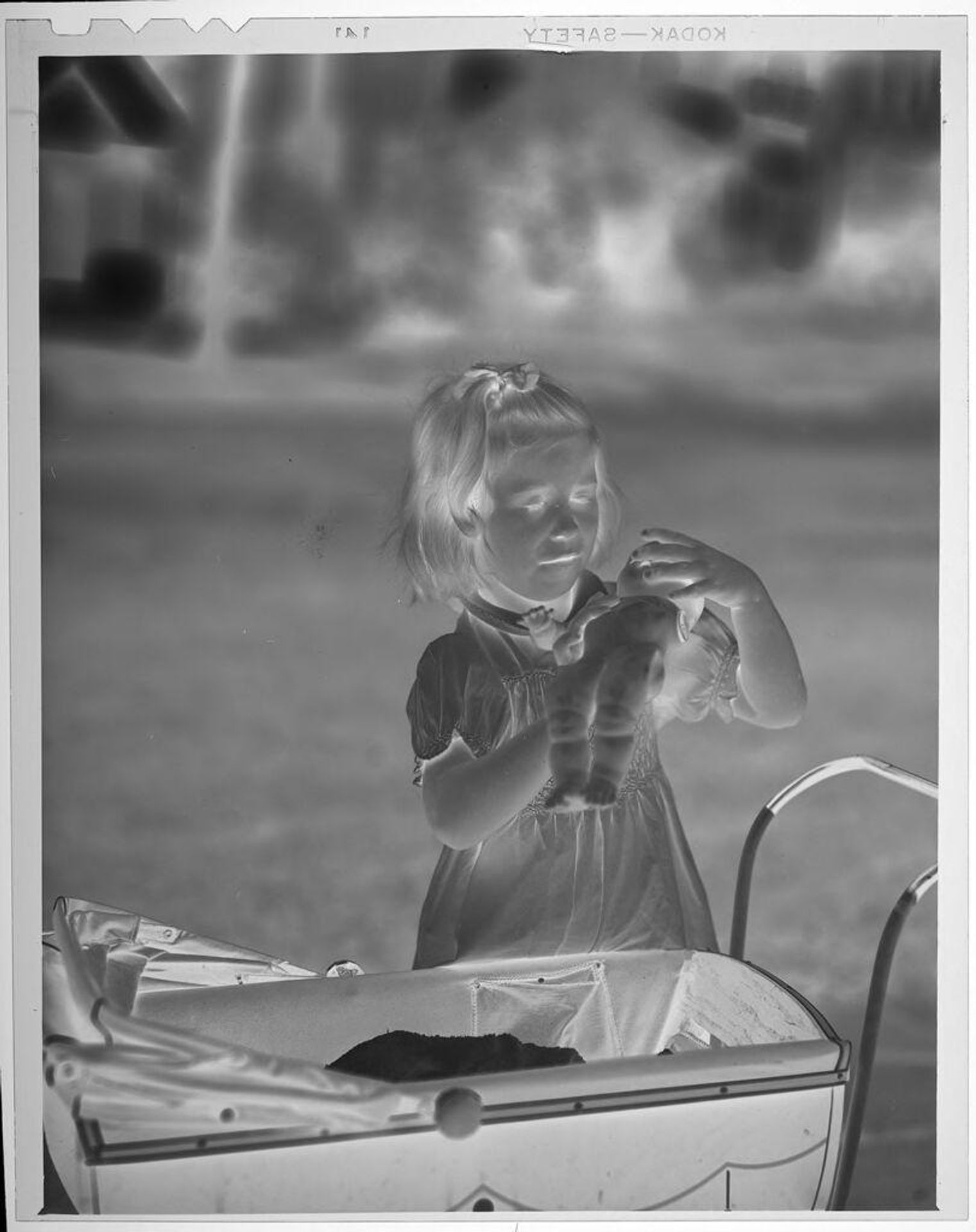 Untitled (girl with doll and baby carraige) by Lucian and Mary Brown